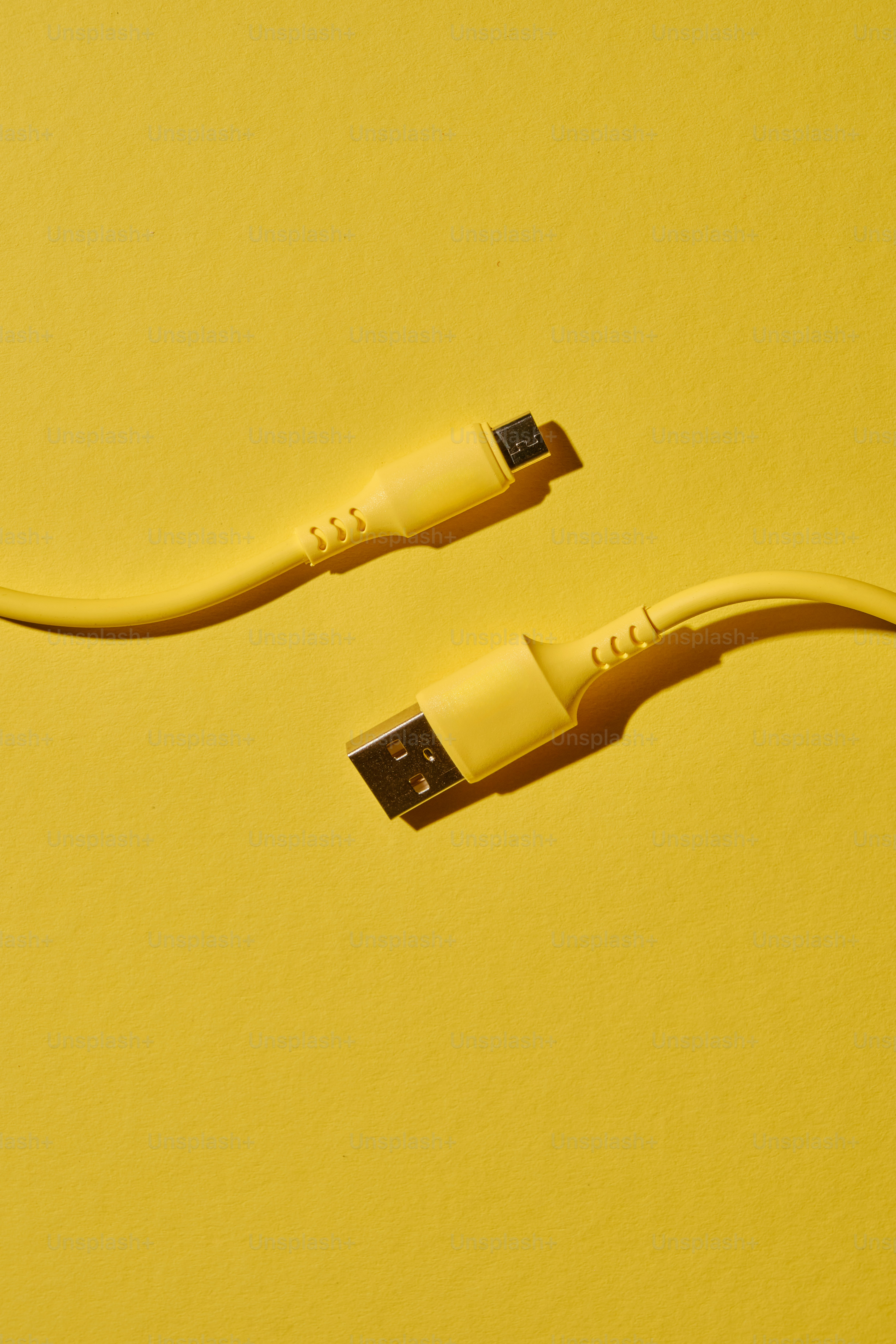Yellow usb cable on a yellow background