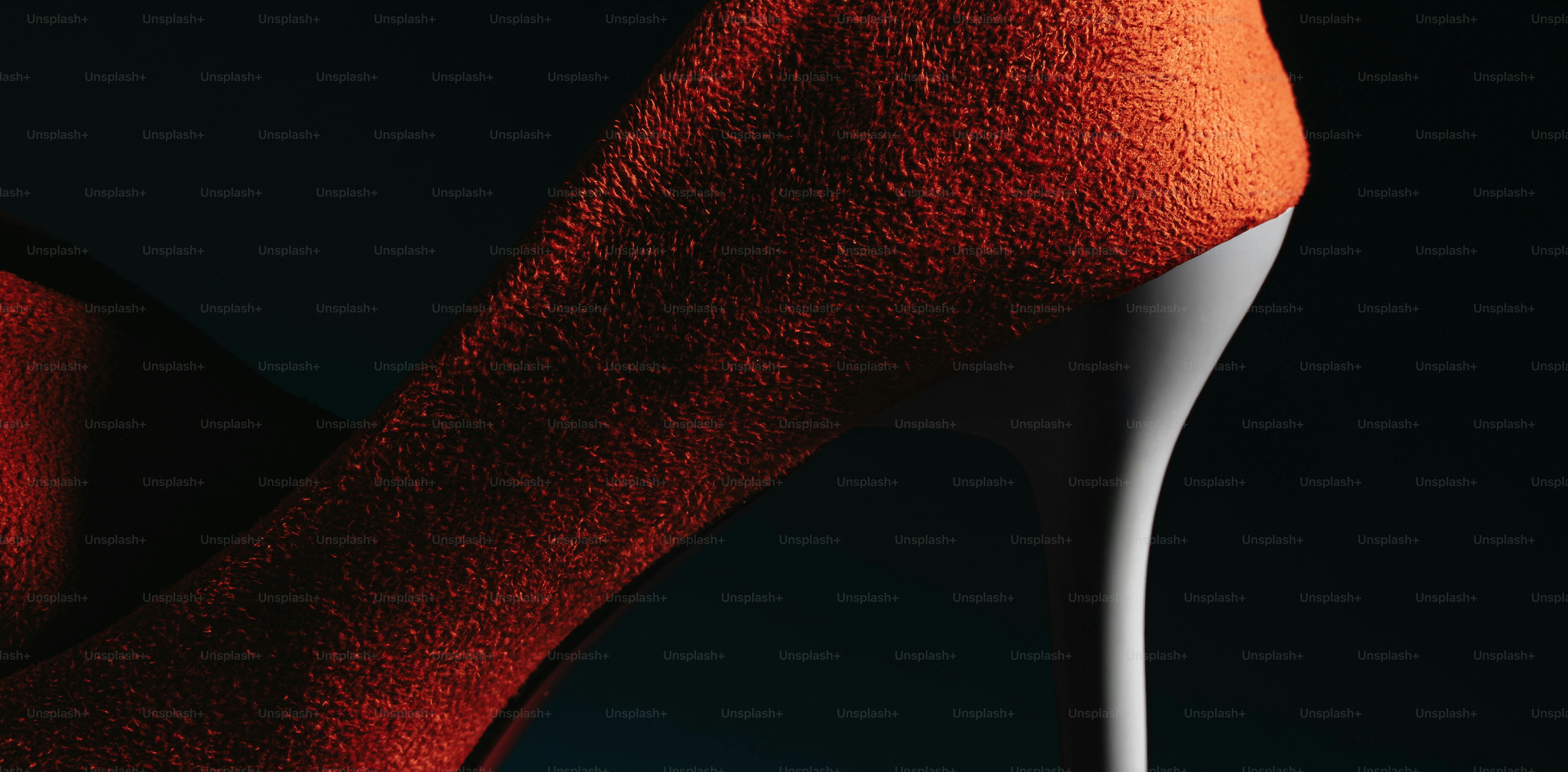Close-up of an orange high-heeled shoe