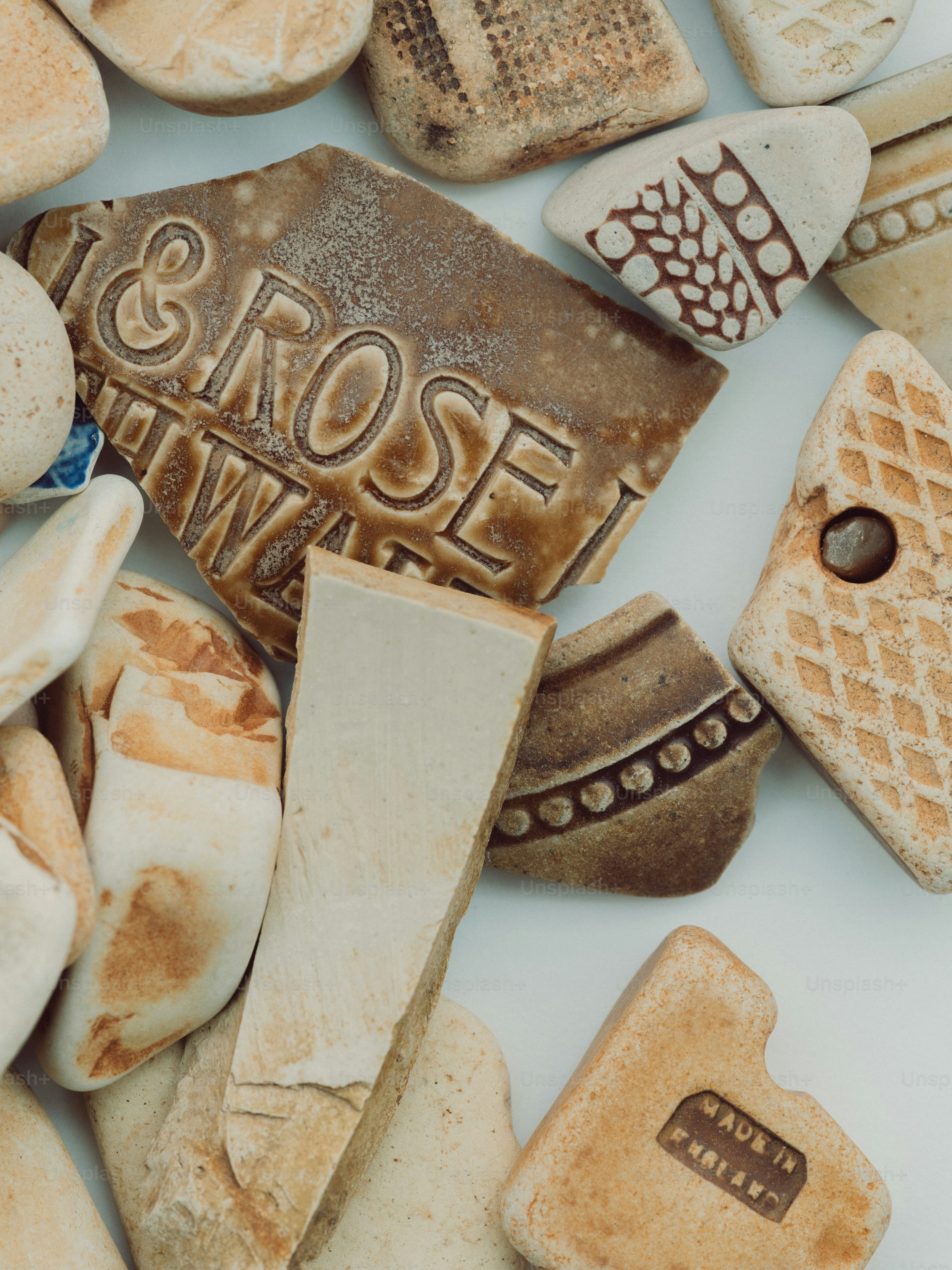 Fragments of pottery with decorative patterns and text
