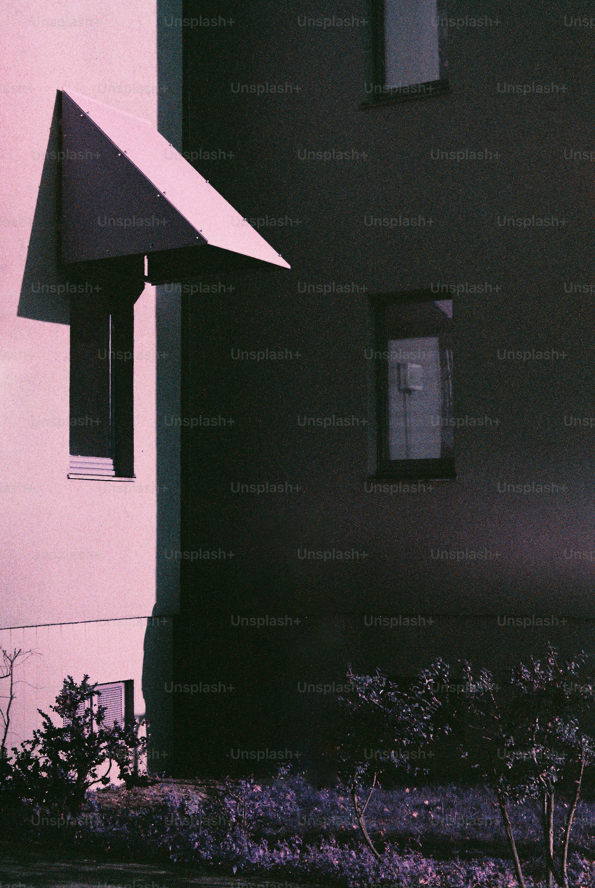 Modern building exterior with geometric awning and windows