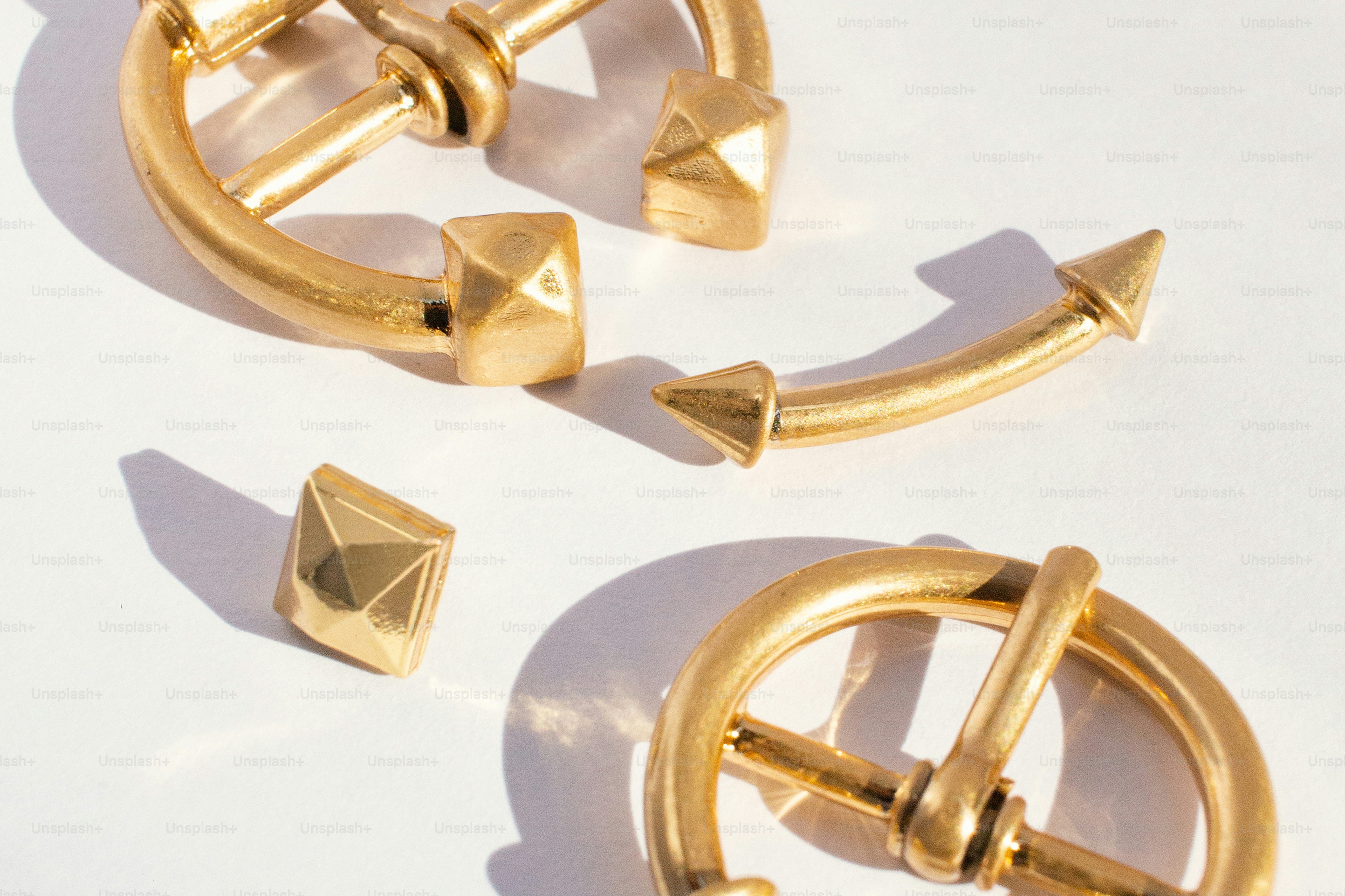Gold jewelry pieces with geometric studs