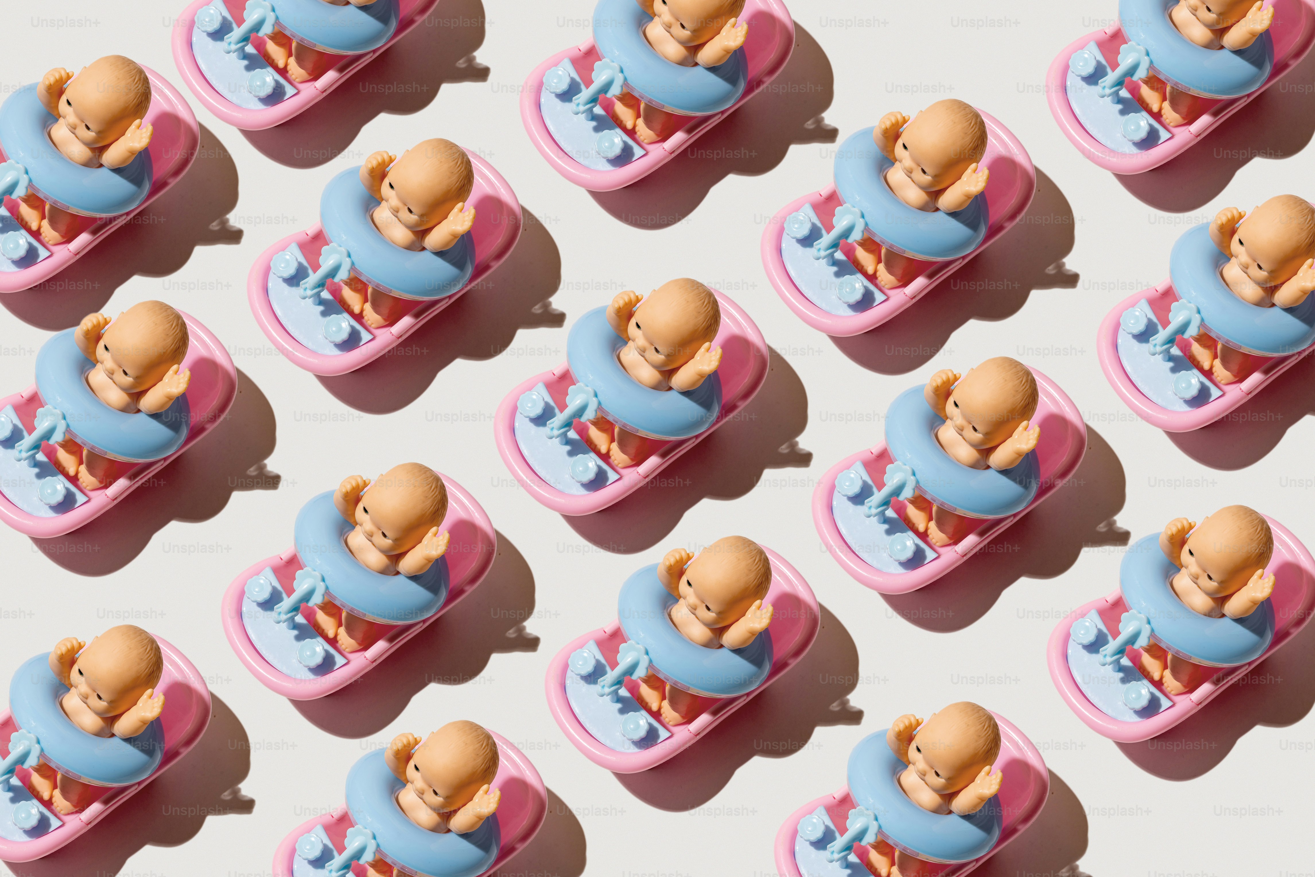 Pattern of baby pacifiers on a white background