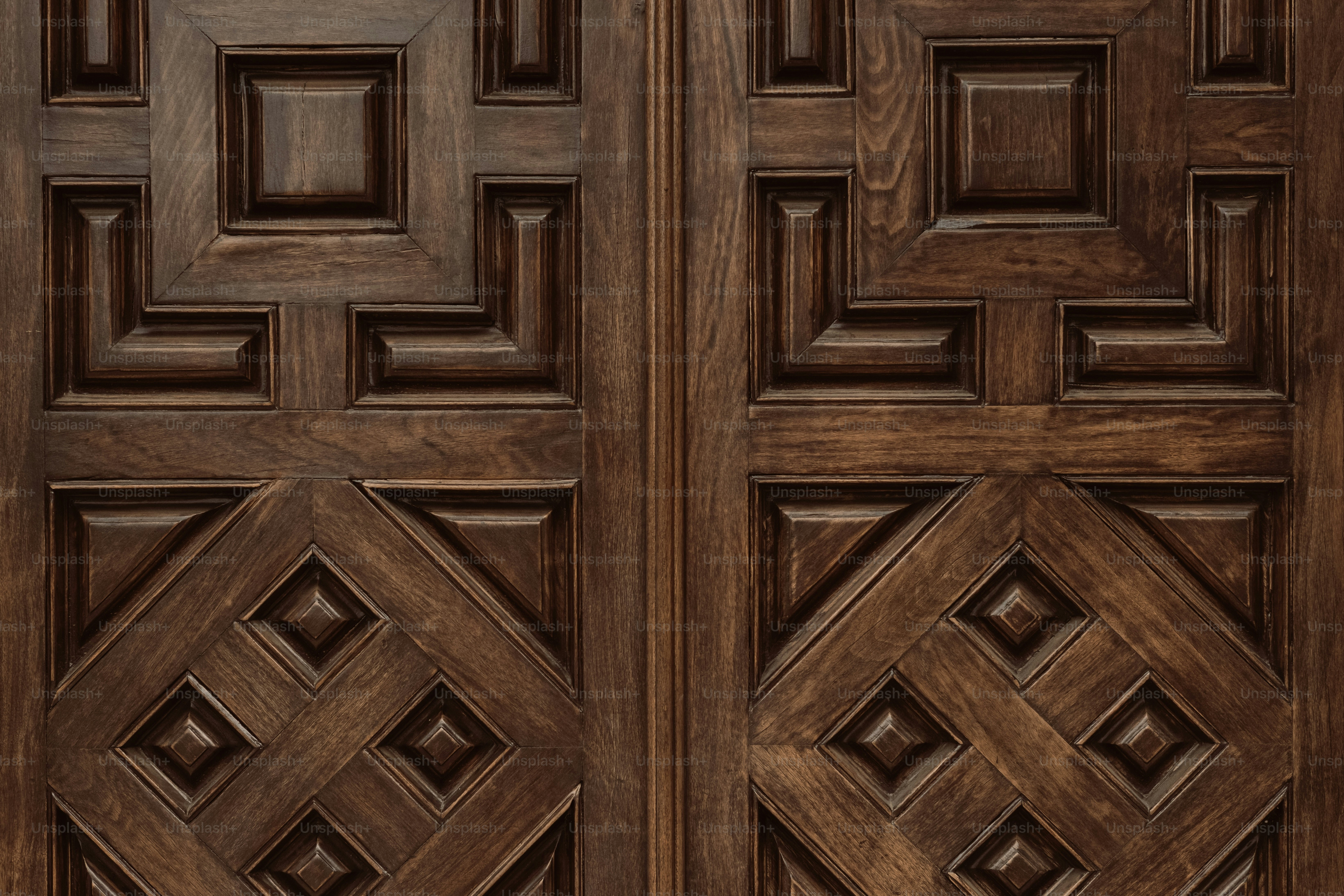 Close-up of ornate dark wood carved doors