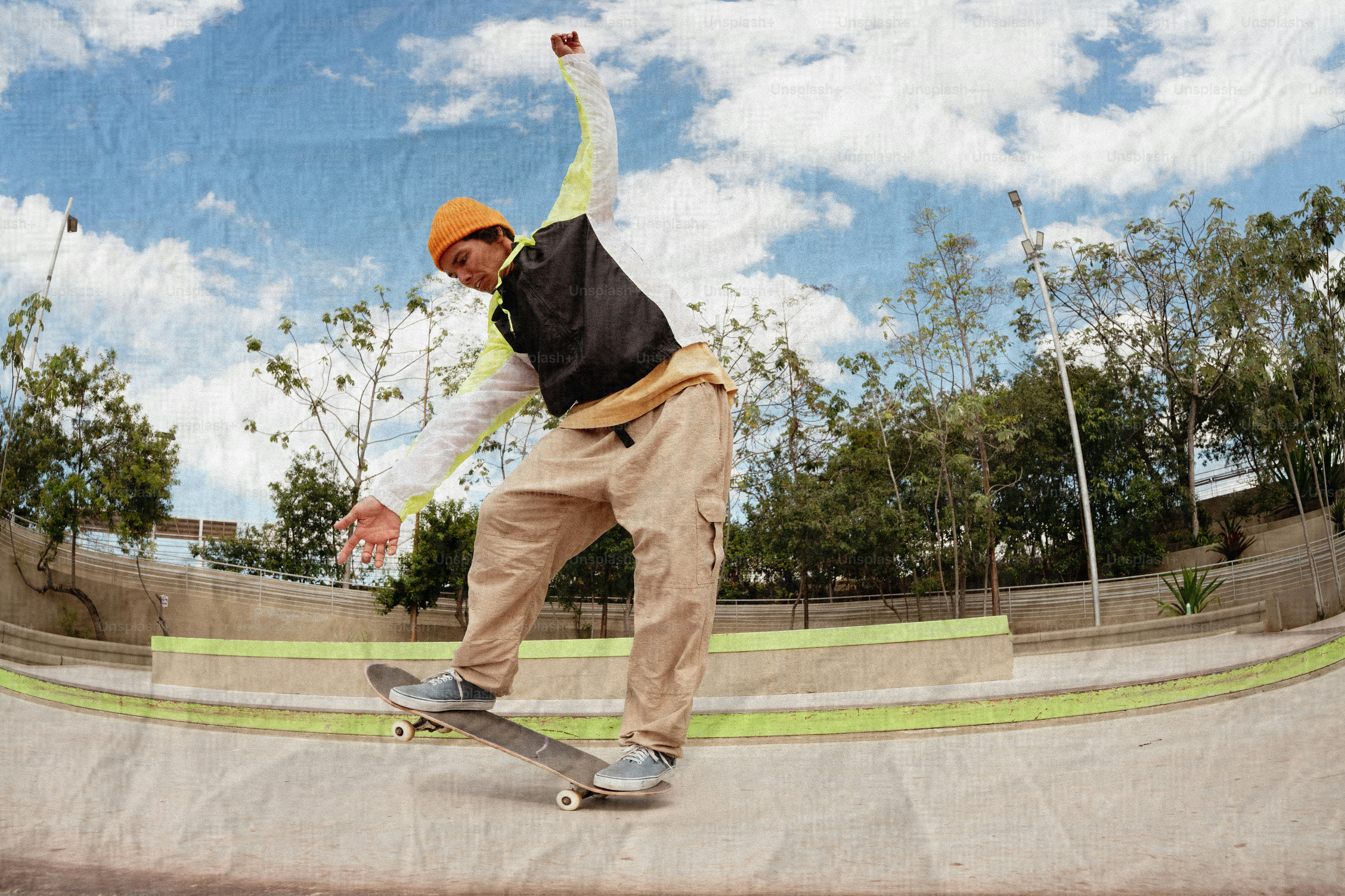 Skateboarder performing a trick in a skatepark.