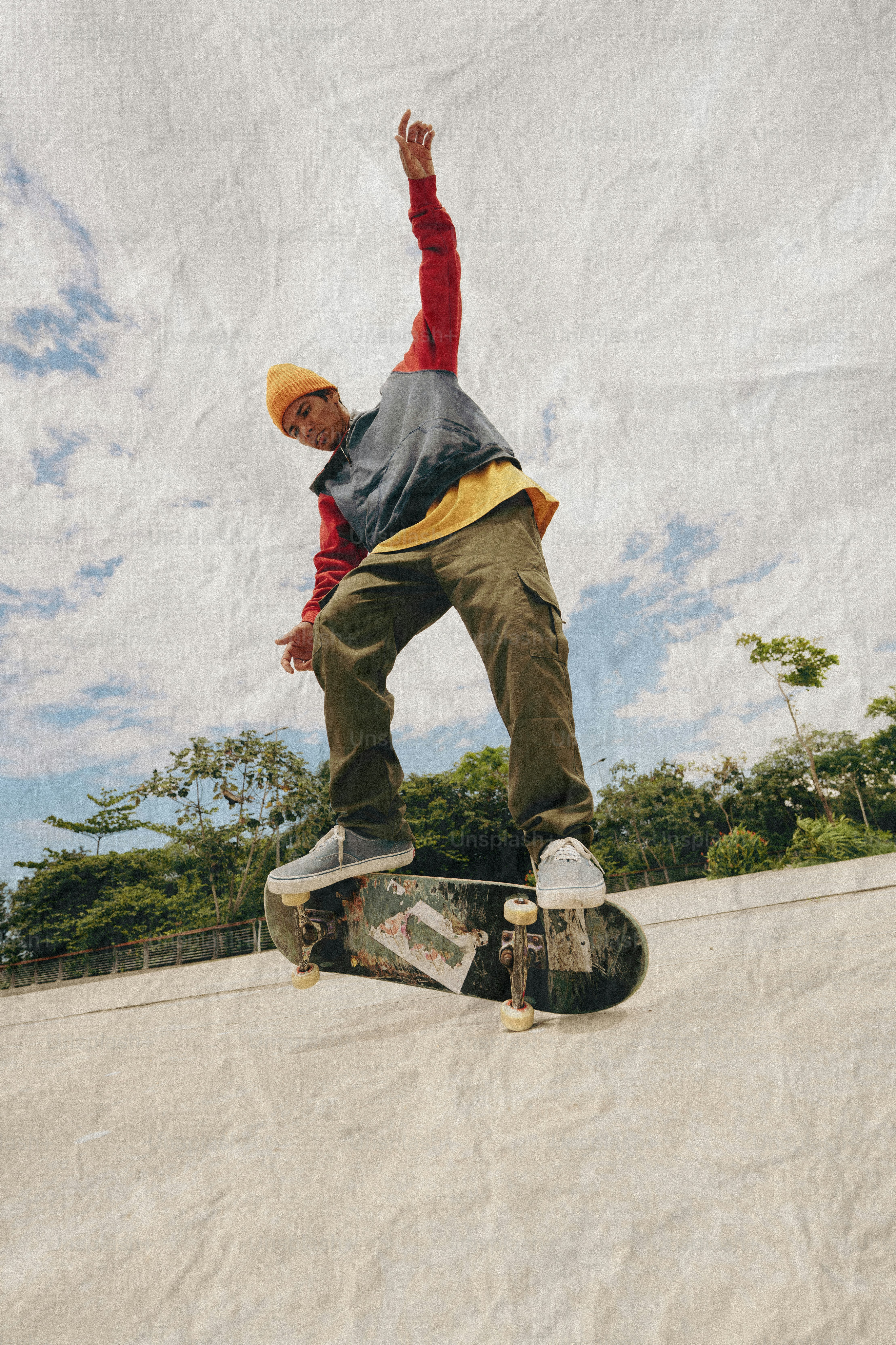 Young man skateboarding on a ramp outdoors