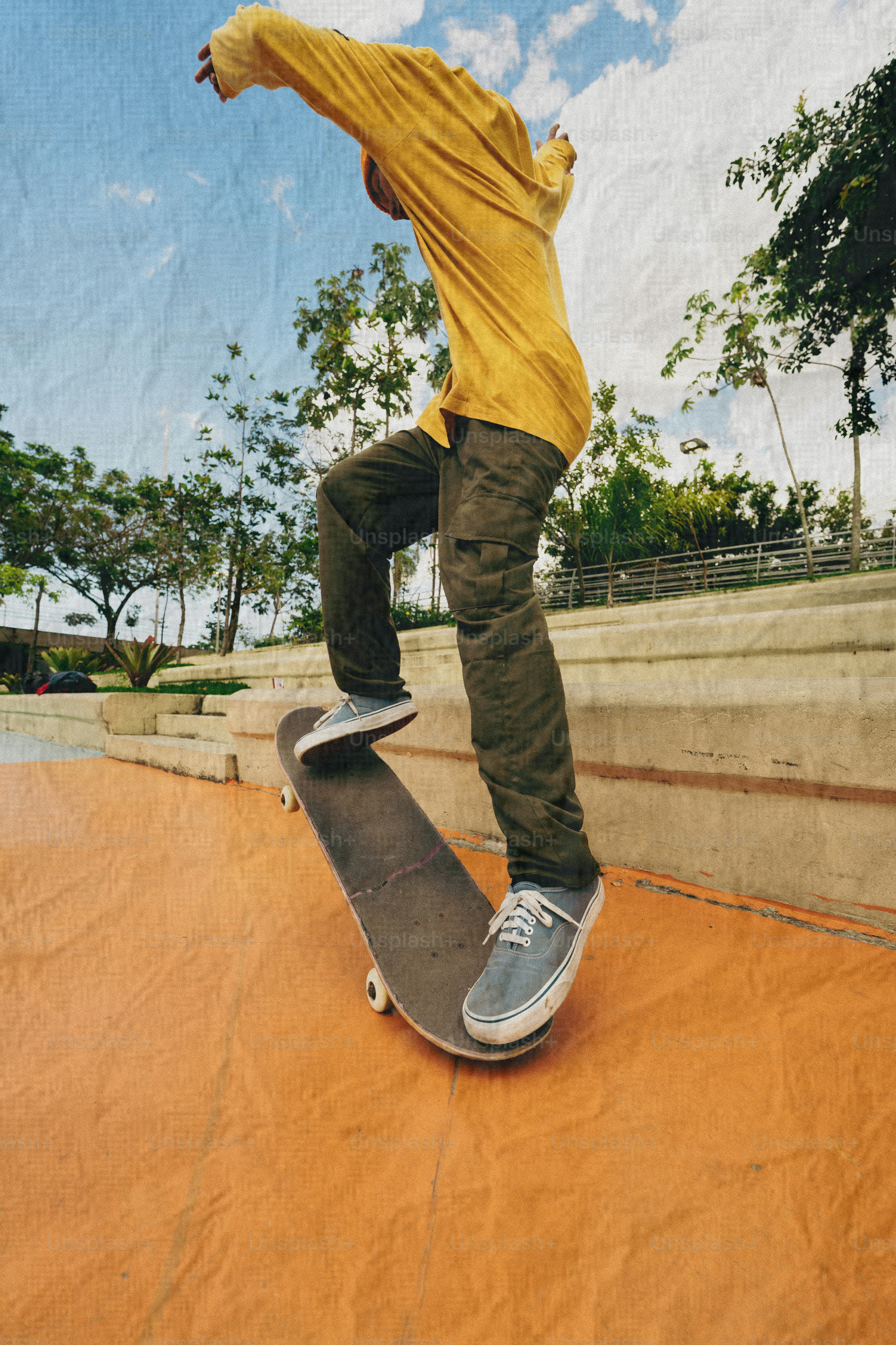 Skateboarder performing a trick in a park