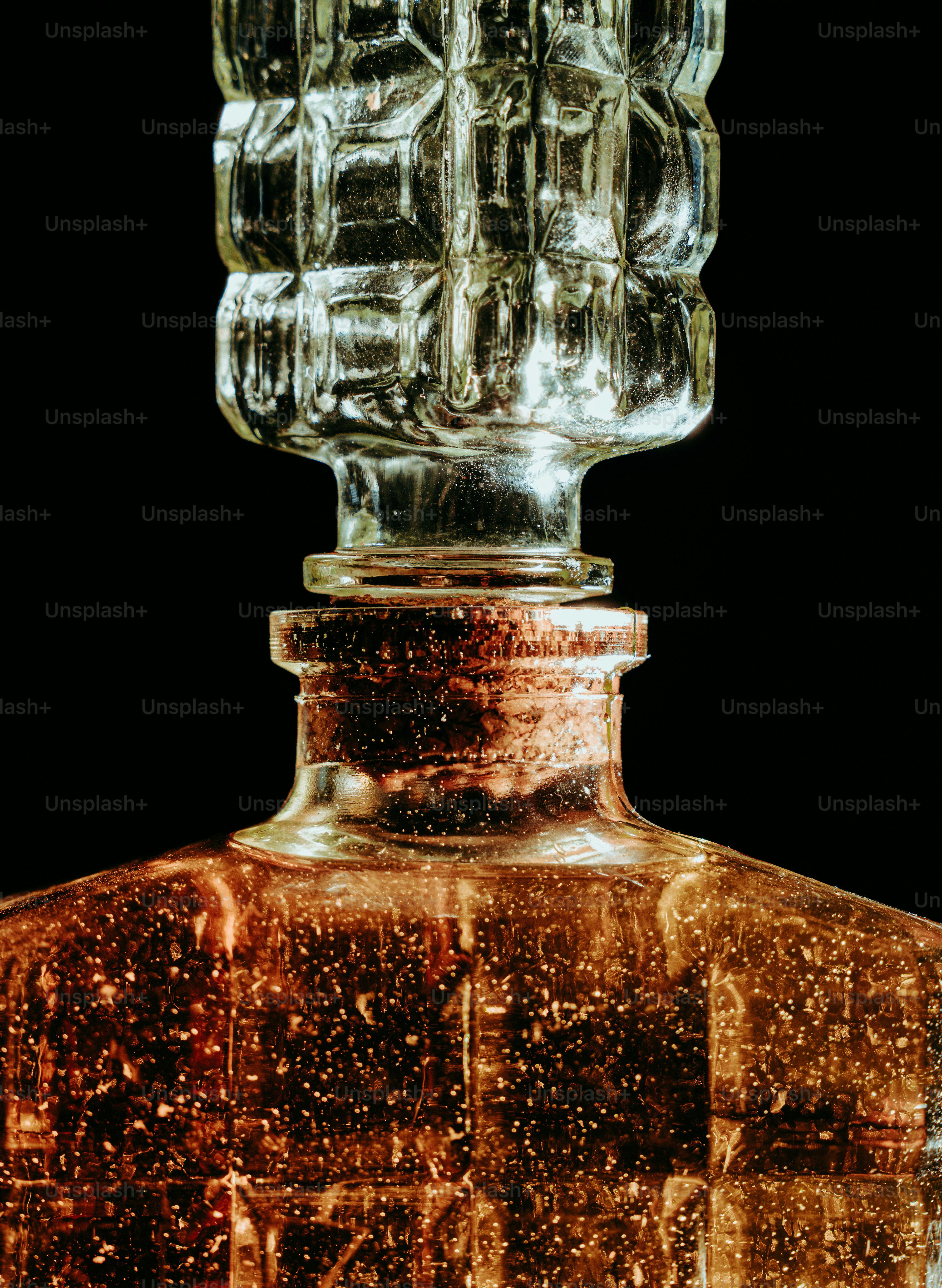 Close up of a glass decanter with bubbles