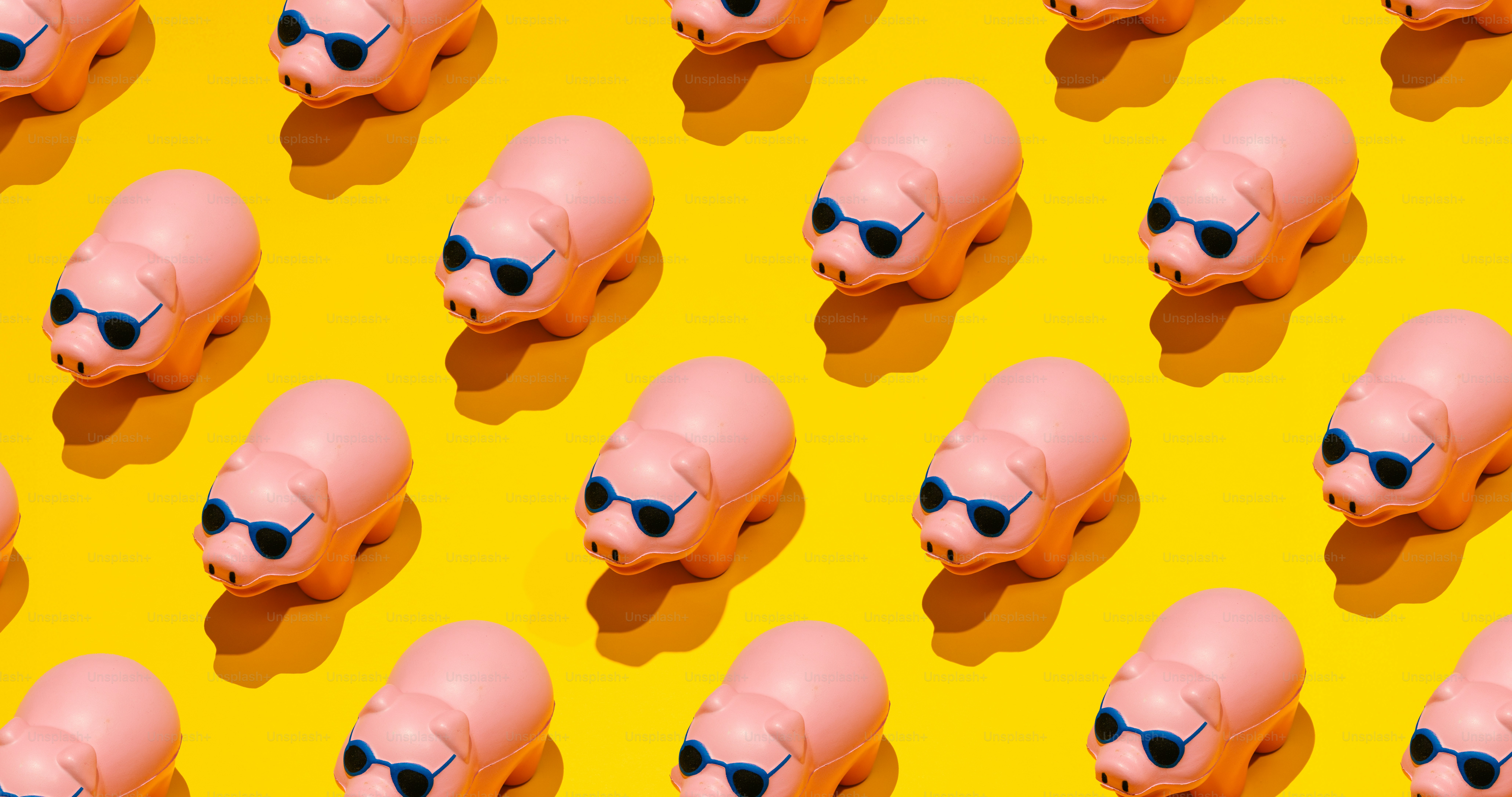 Many pink pigs wearing sunglasses on yellow background