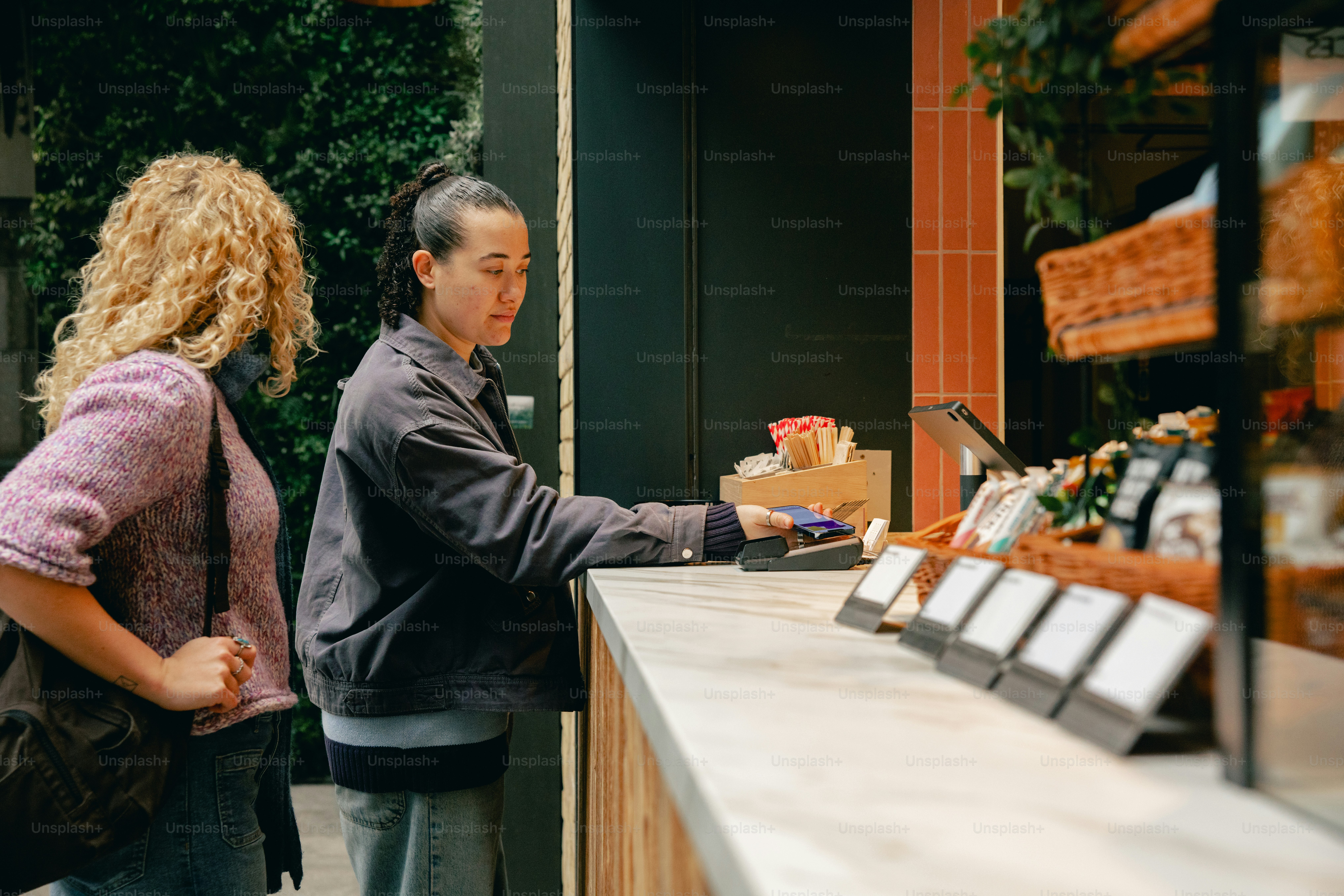 People paying at a counter in a store