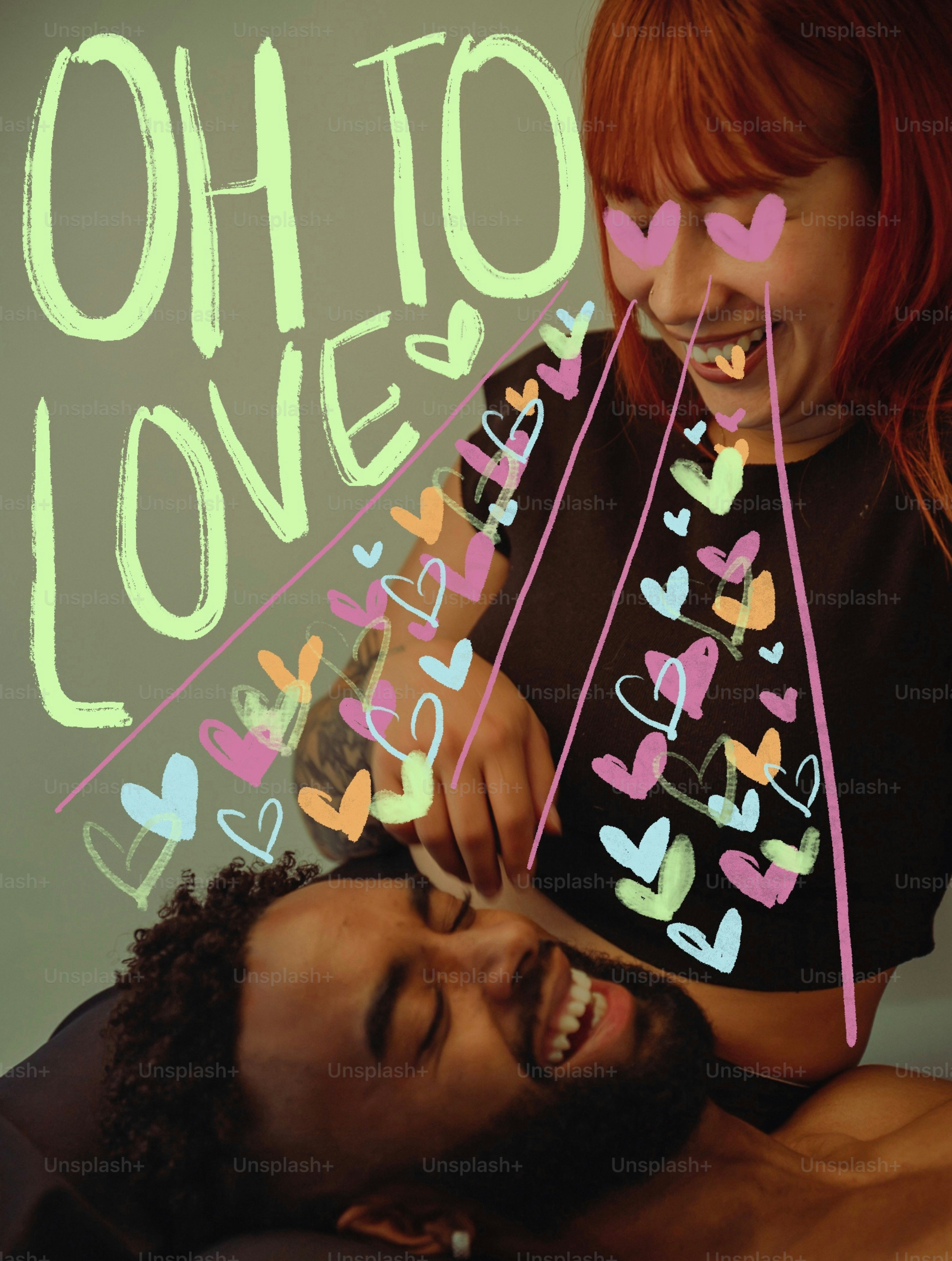 Couple laughing with hearts drawn around them.
