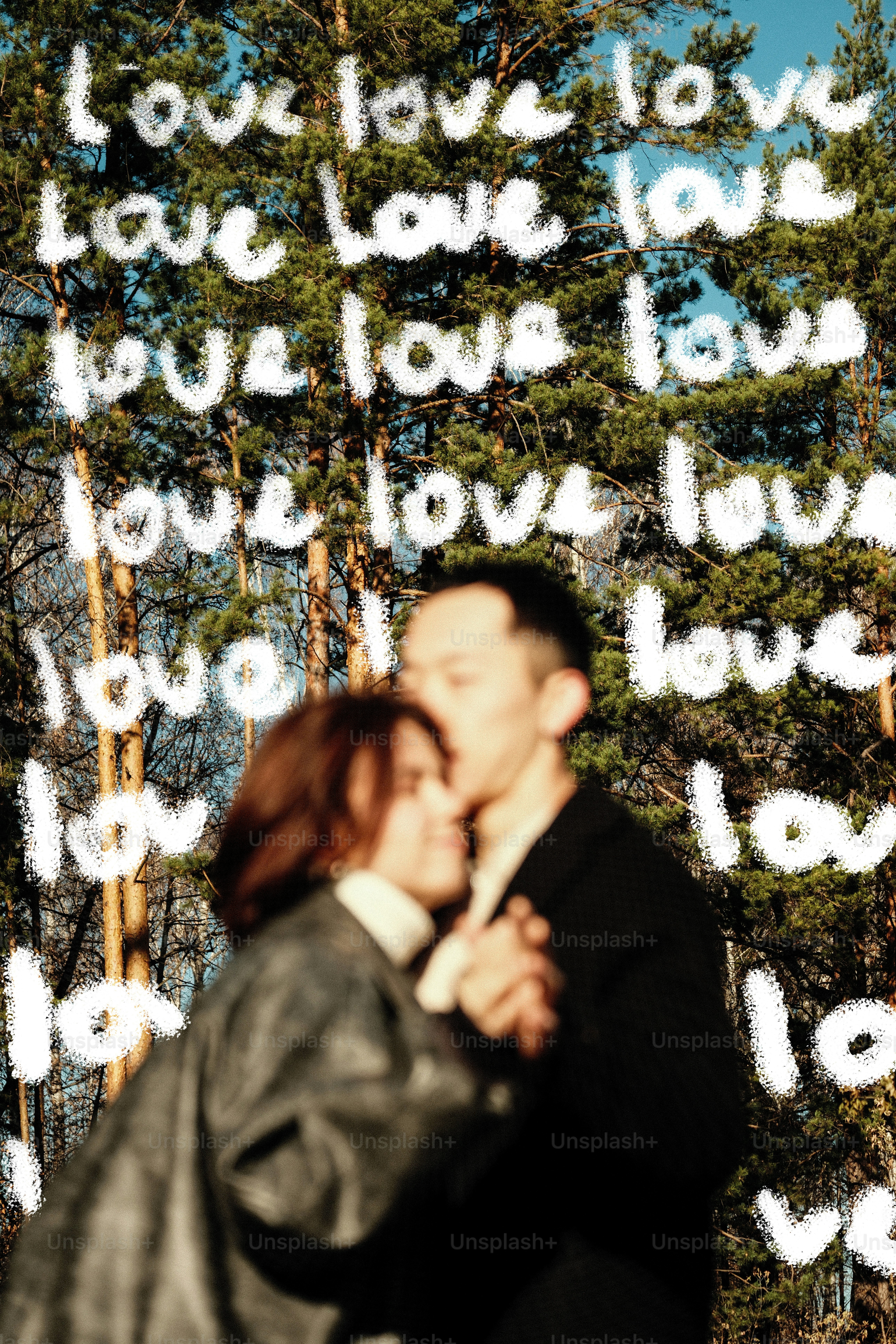 Couple dancing with "love" written behind them