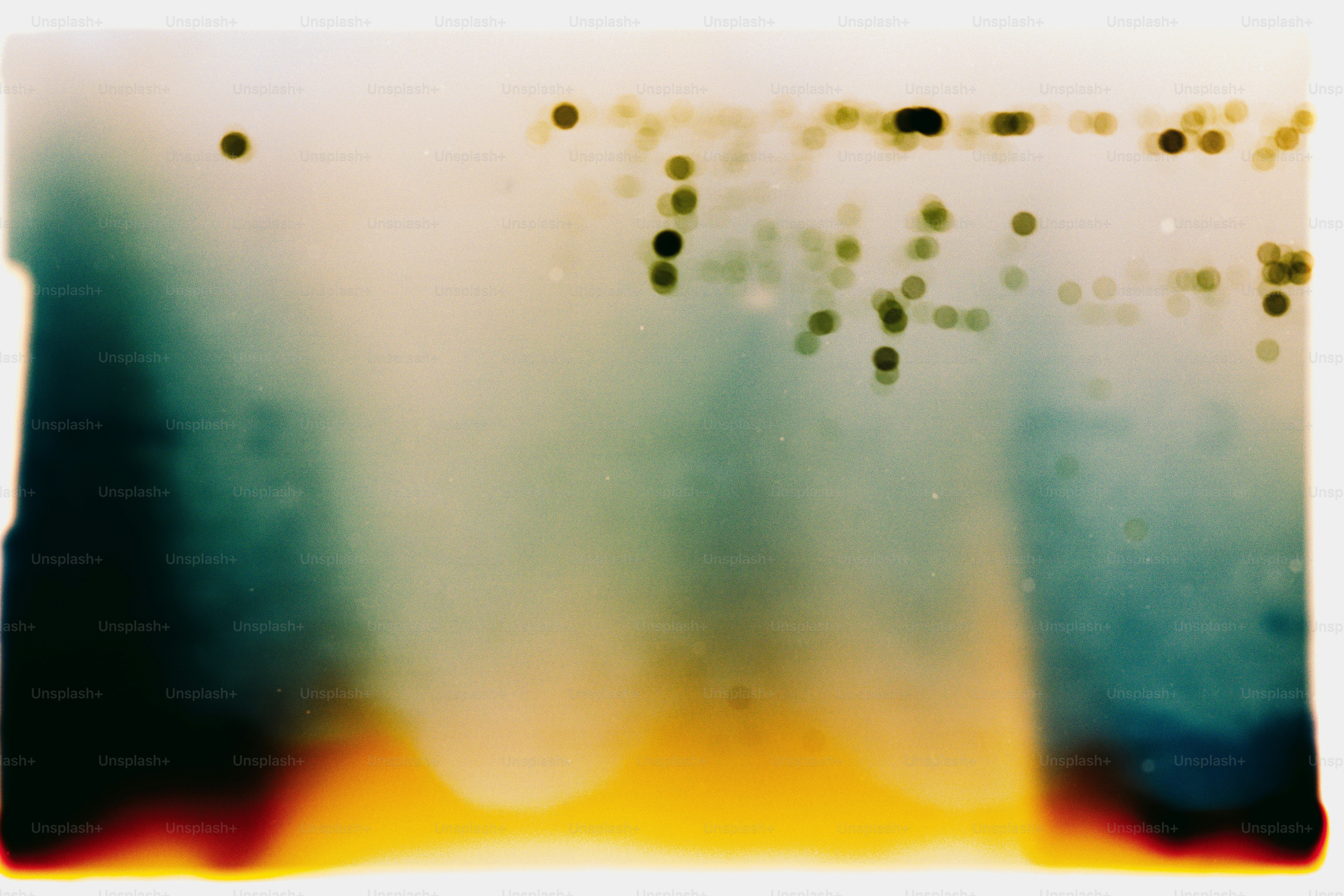 Abstract streaks of color with blurred dots