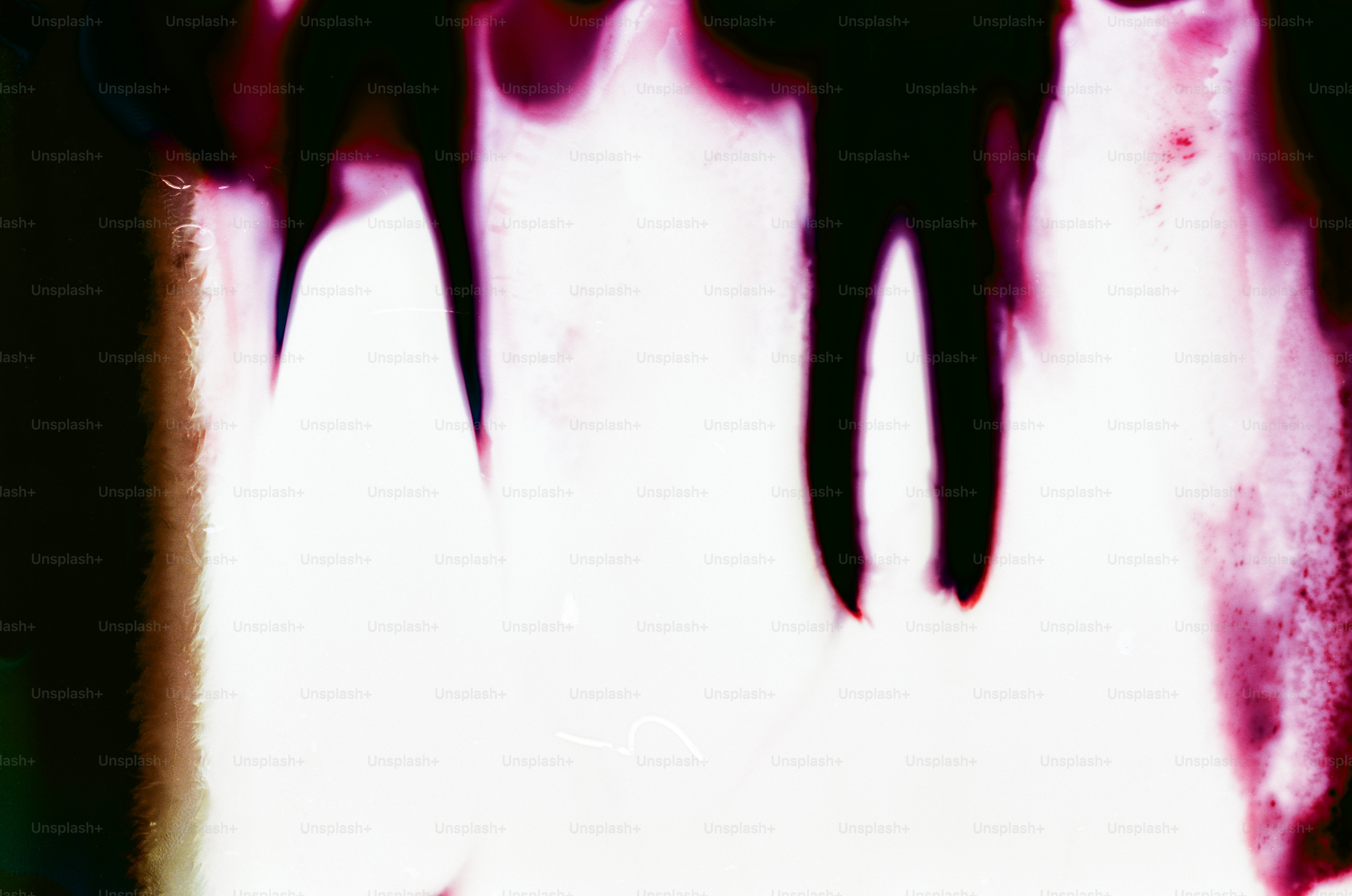 Abstract streaks of pink and white light.