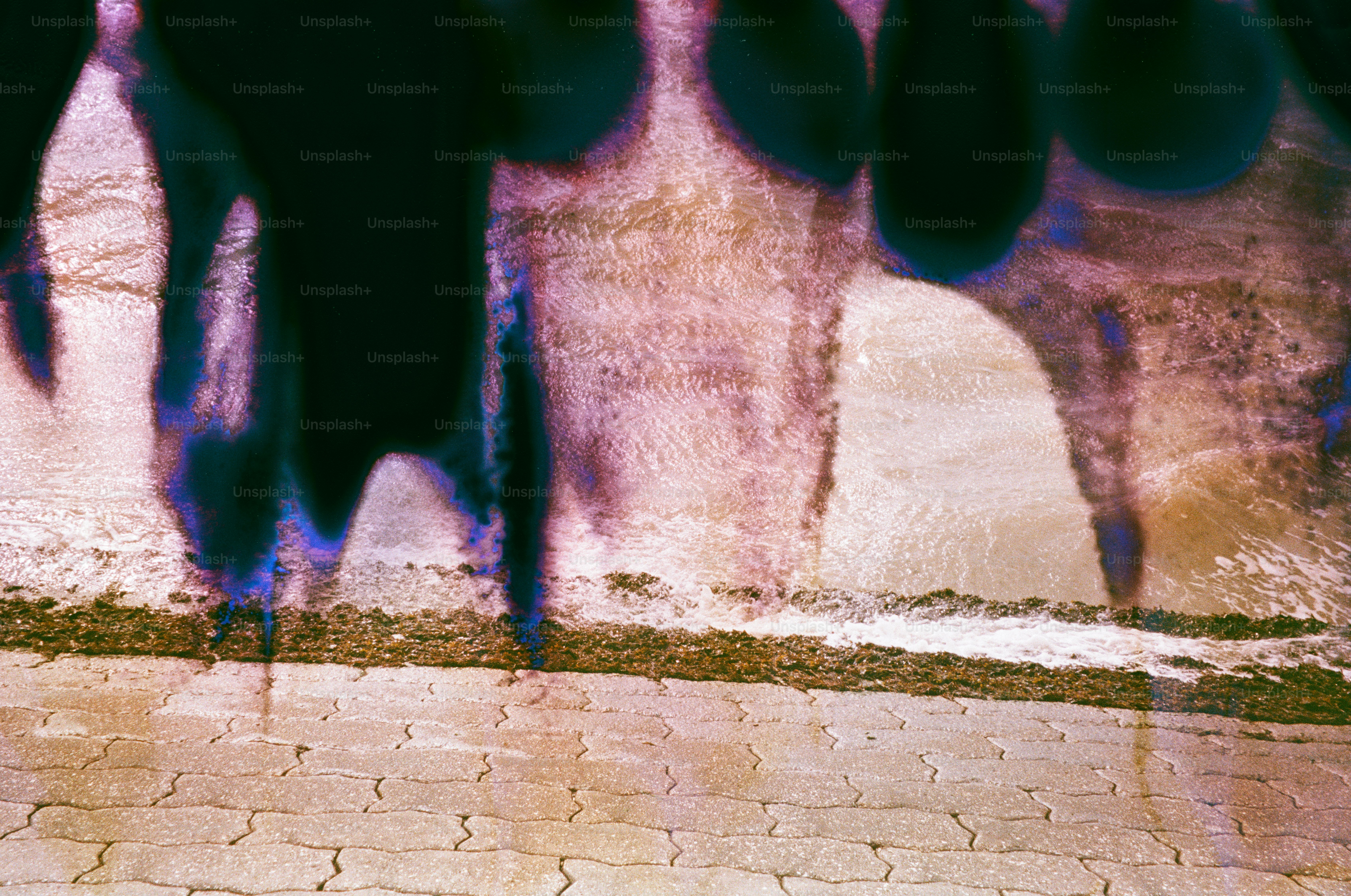 Abstract textured wall with dark dripping shapes