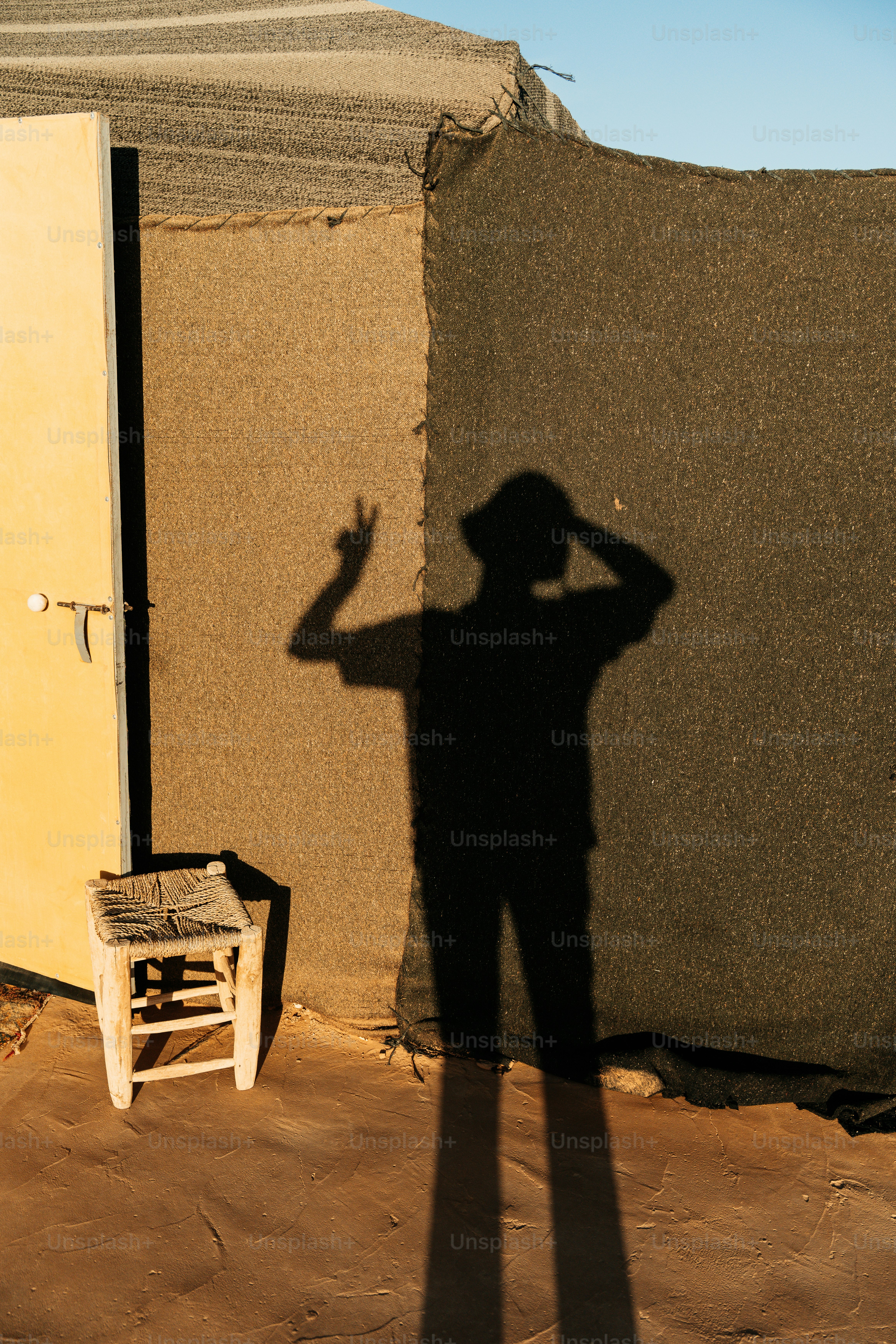 Shadow of a person making peace sign on wall photo – Travel Image on ...