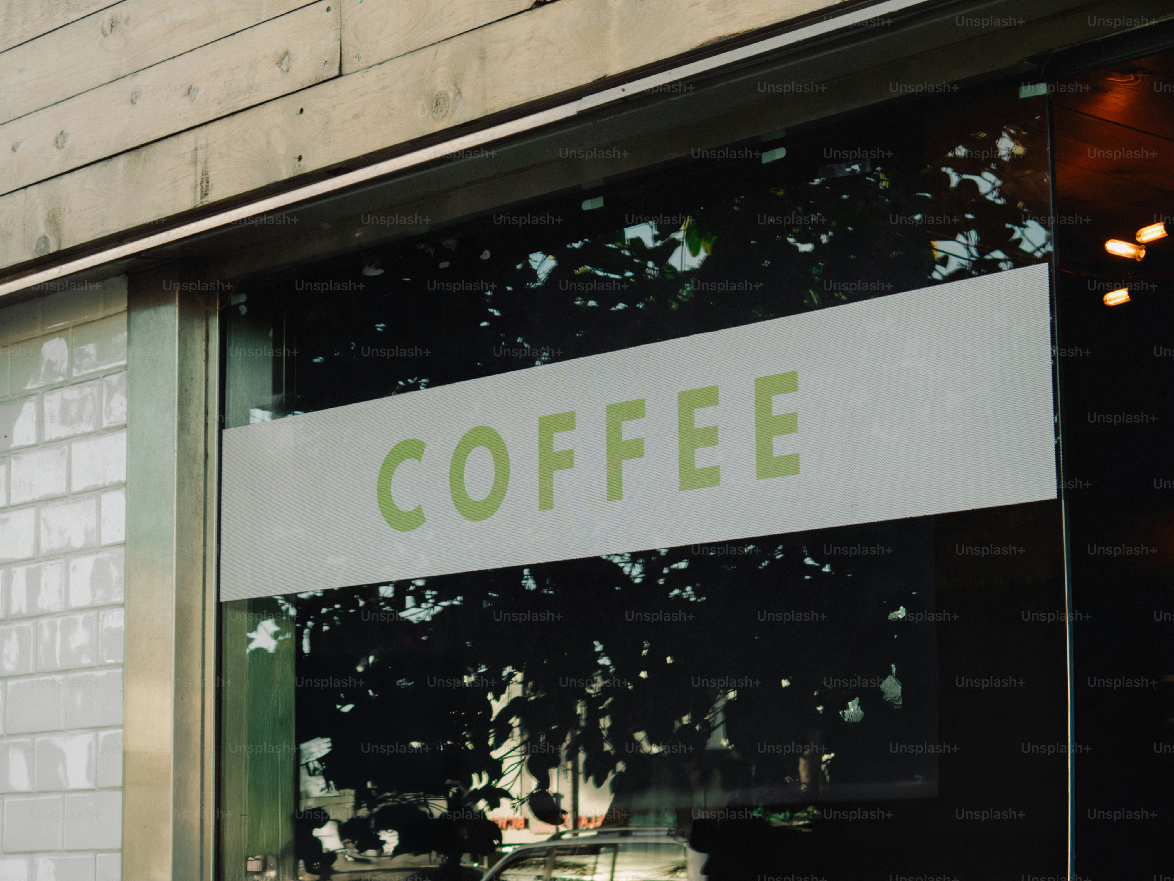 A sign on a window says "coffee"