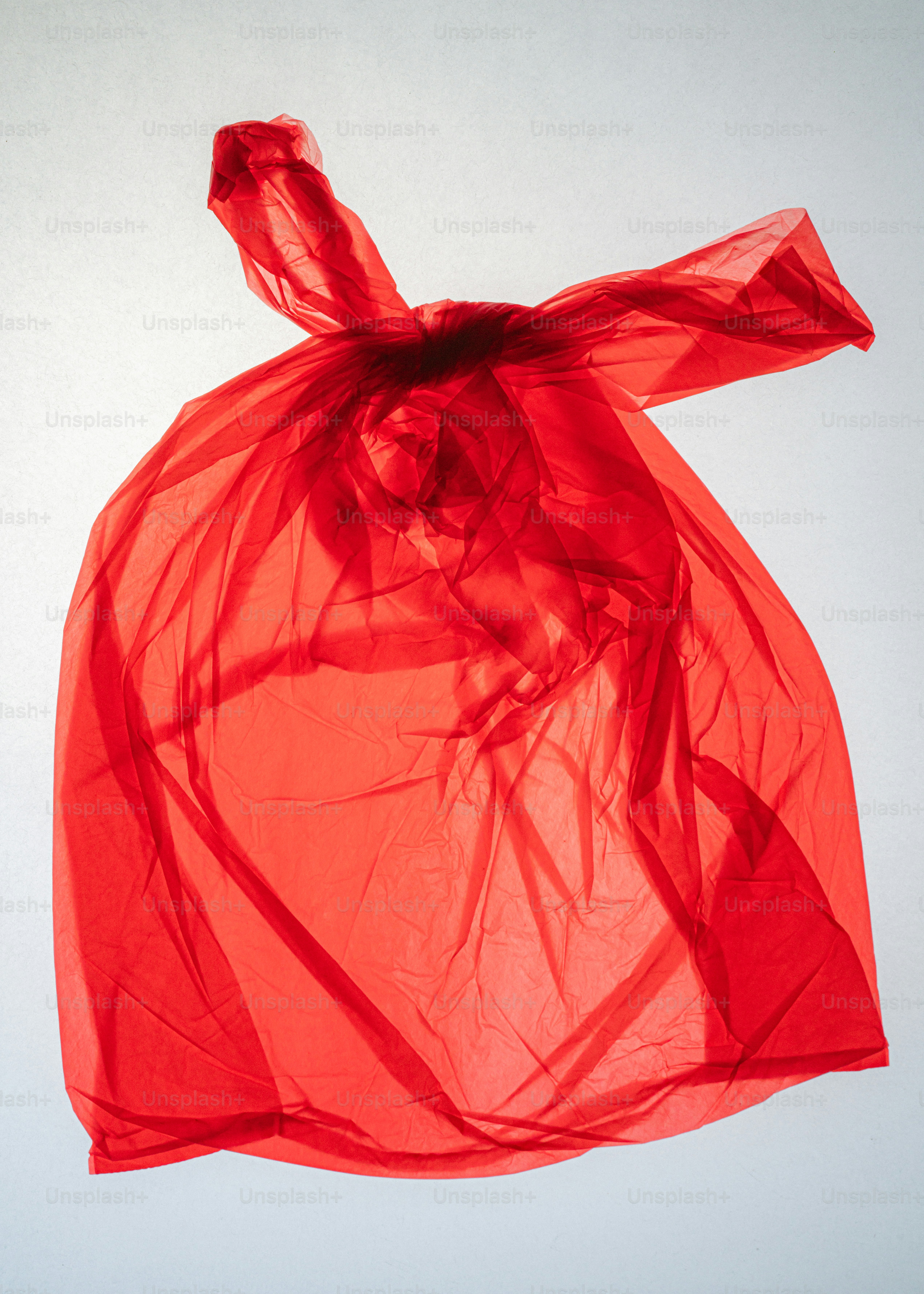 A red translucent bag tied at the top