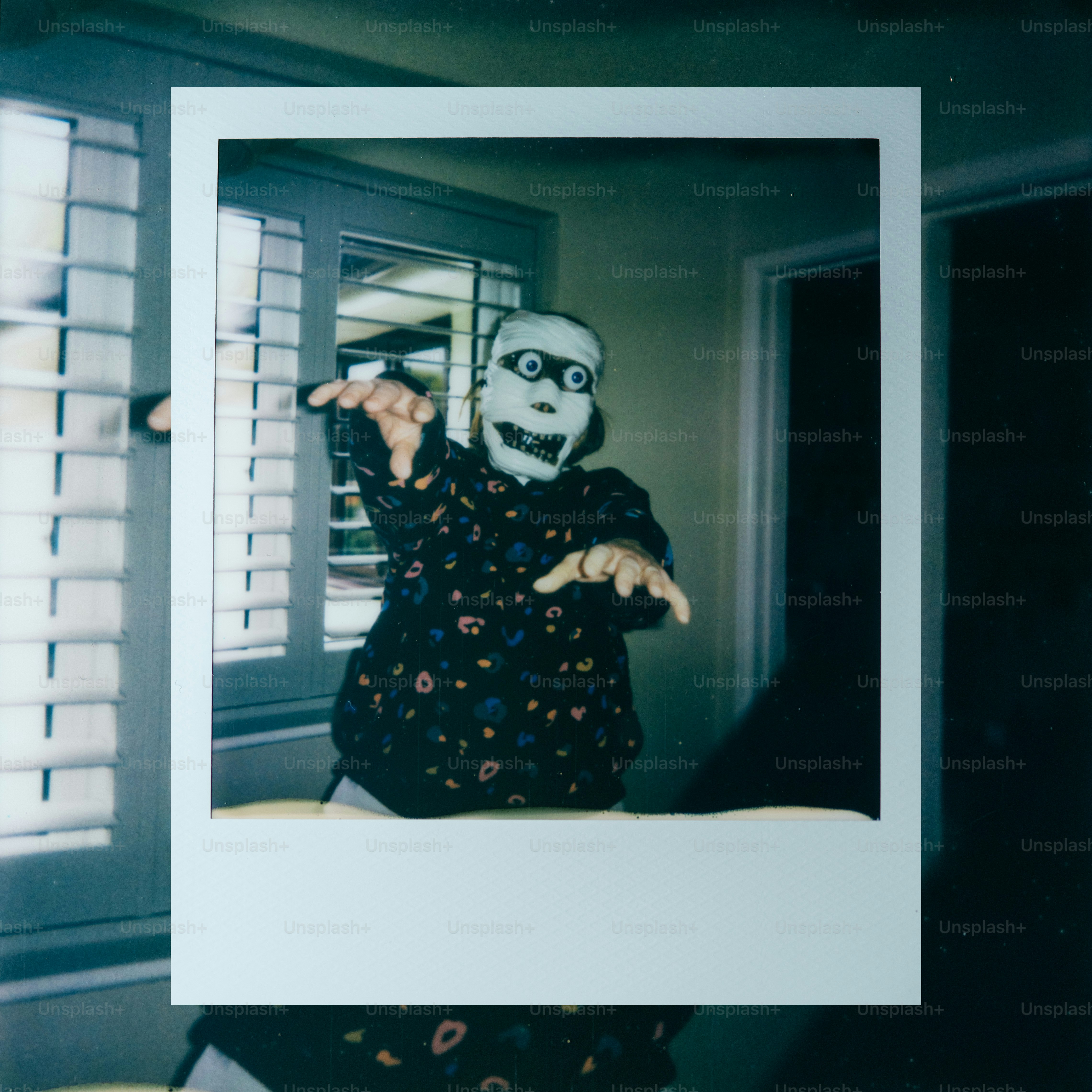 Person in a spooky mask reaching out