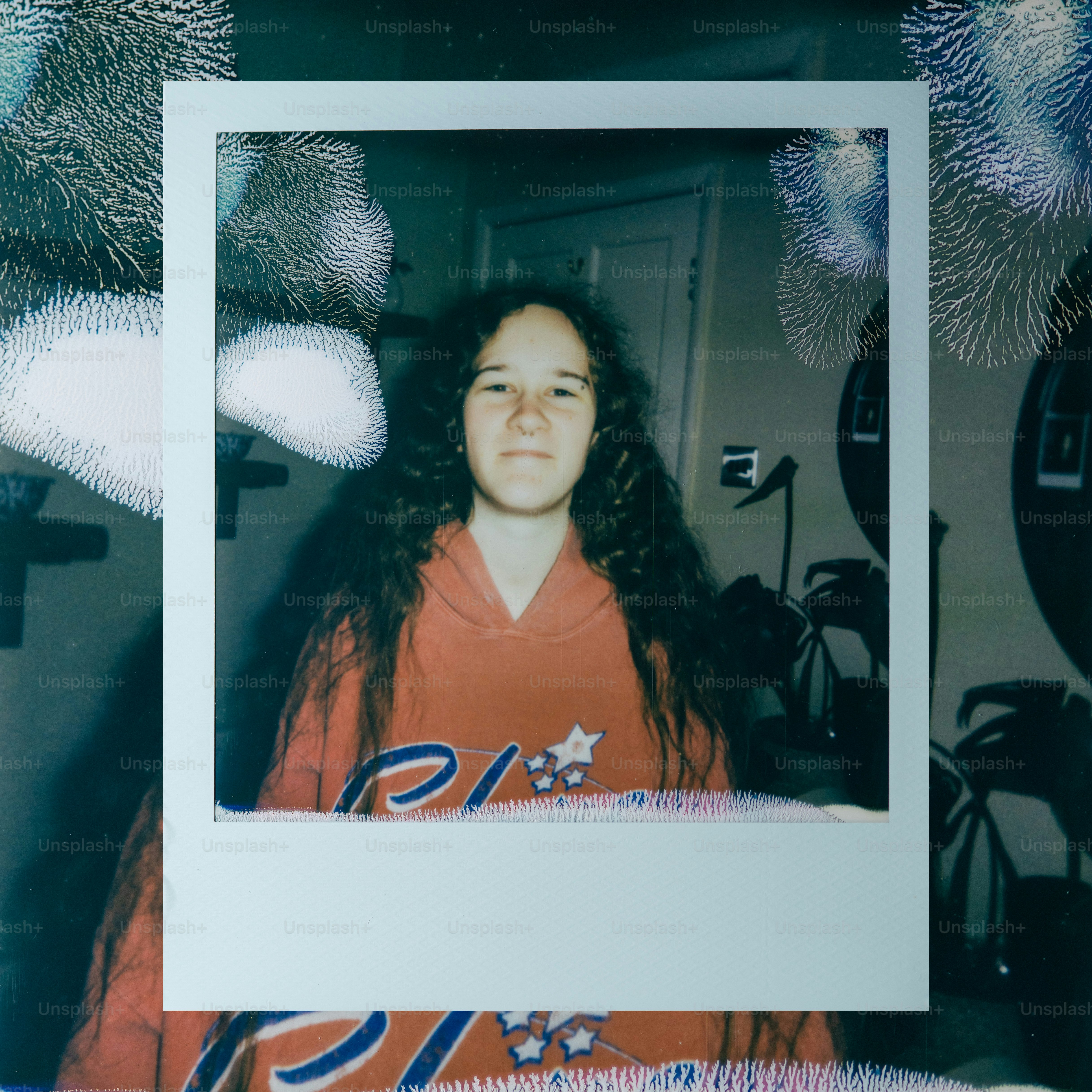 Young woman with long curly hair in hoodie
