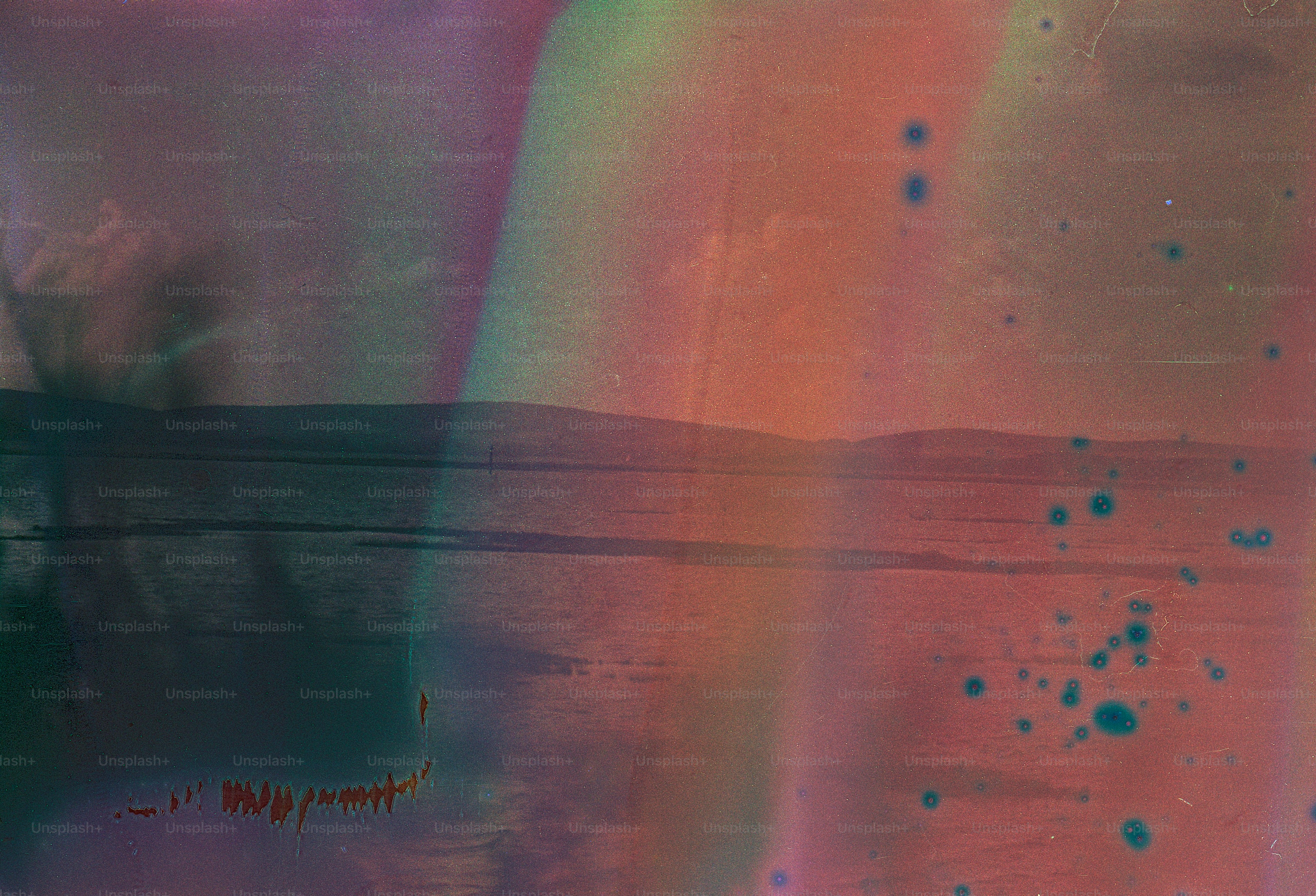 Abstract landscape with colorful hues and water reflections