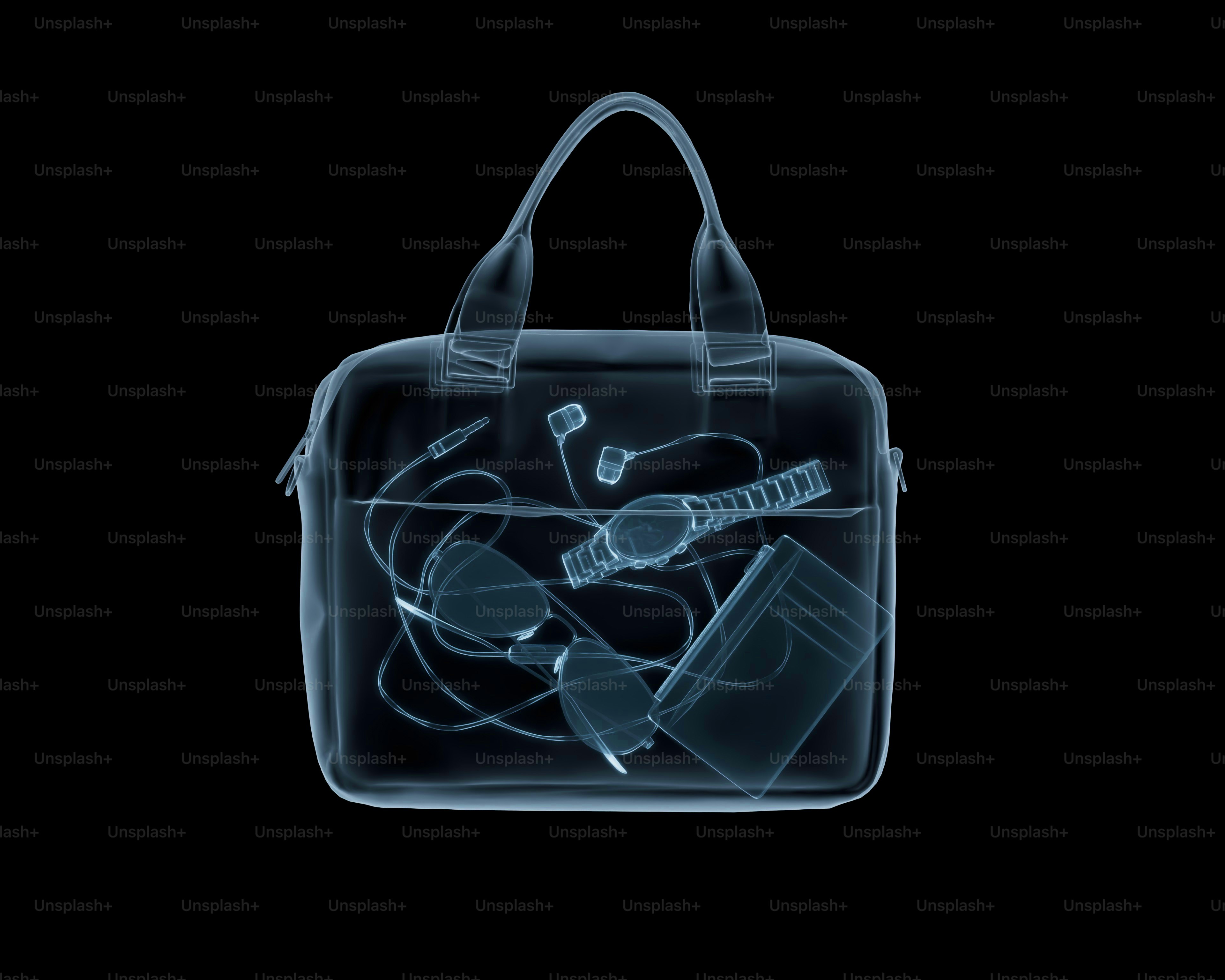 X-ray of a bag with earphones, watch, and sunglasses