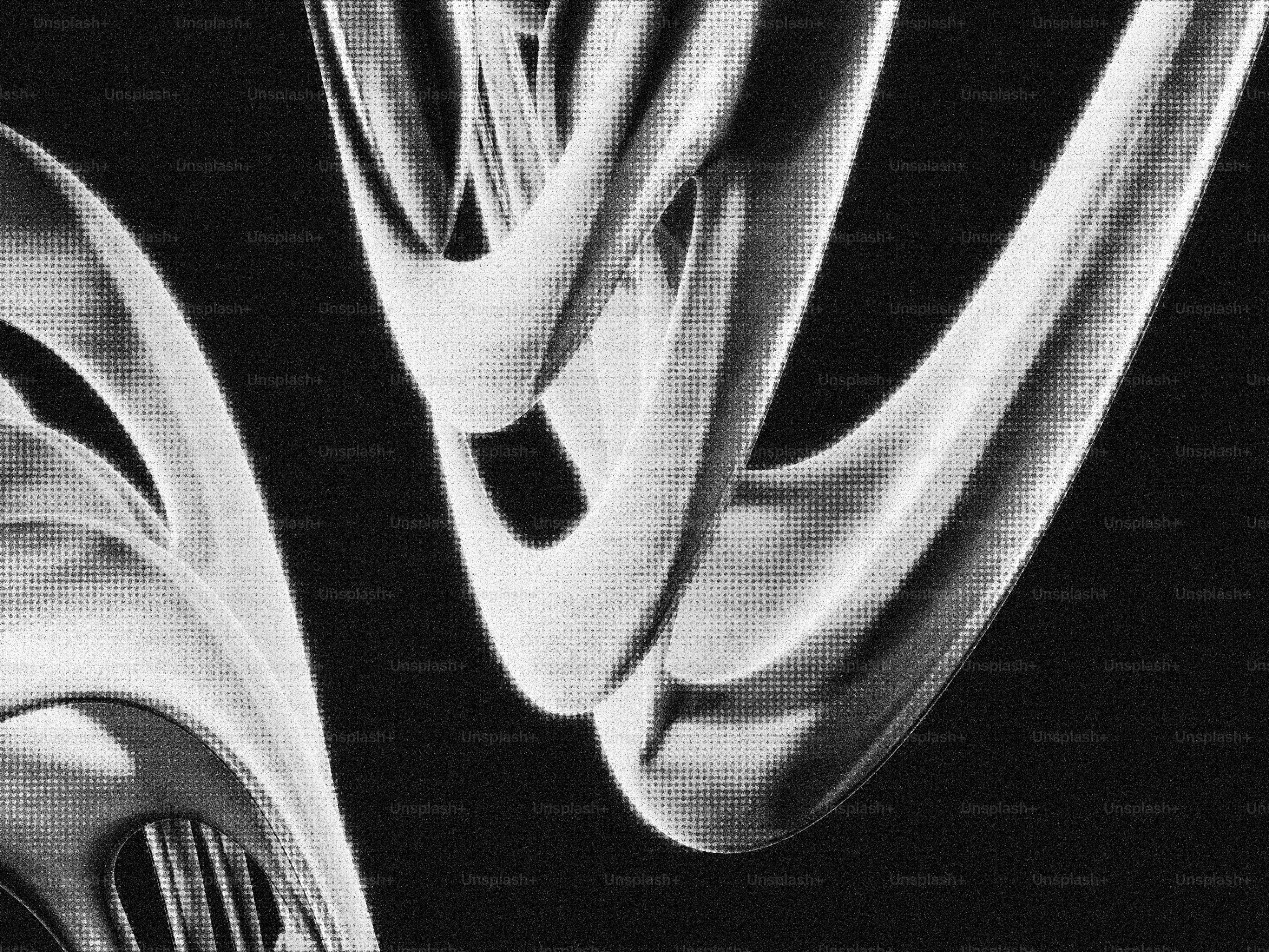 Abstract metallic shapes against a dark background