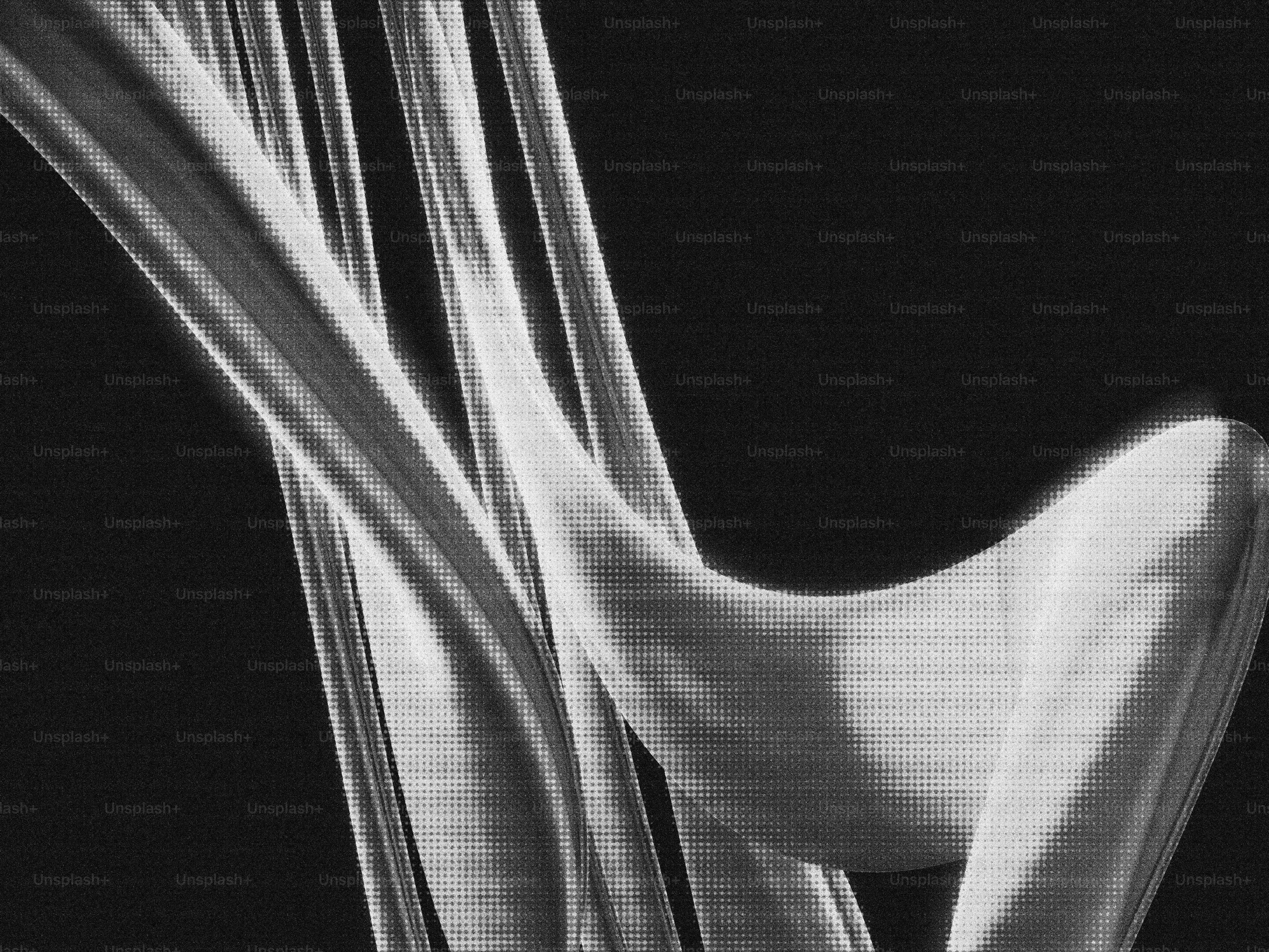 Abstract white forms against a dark background