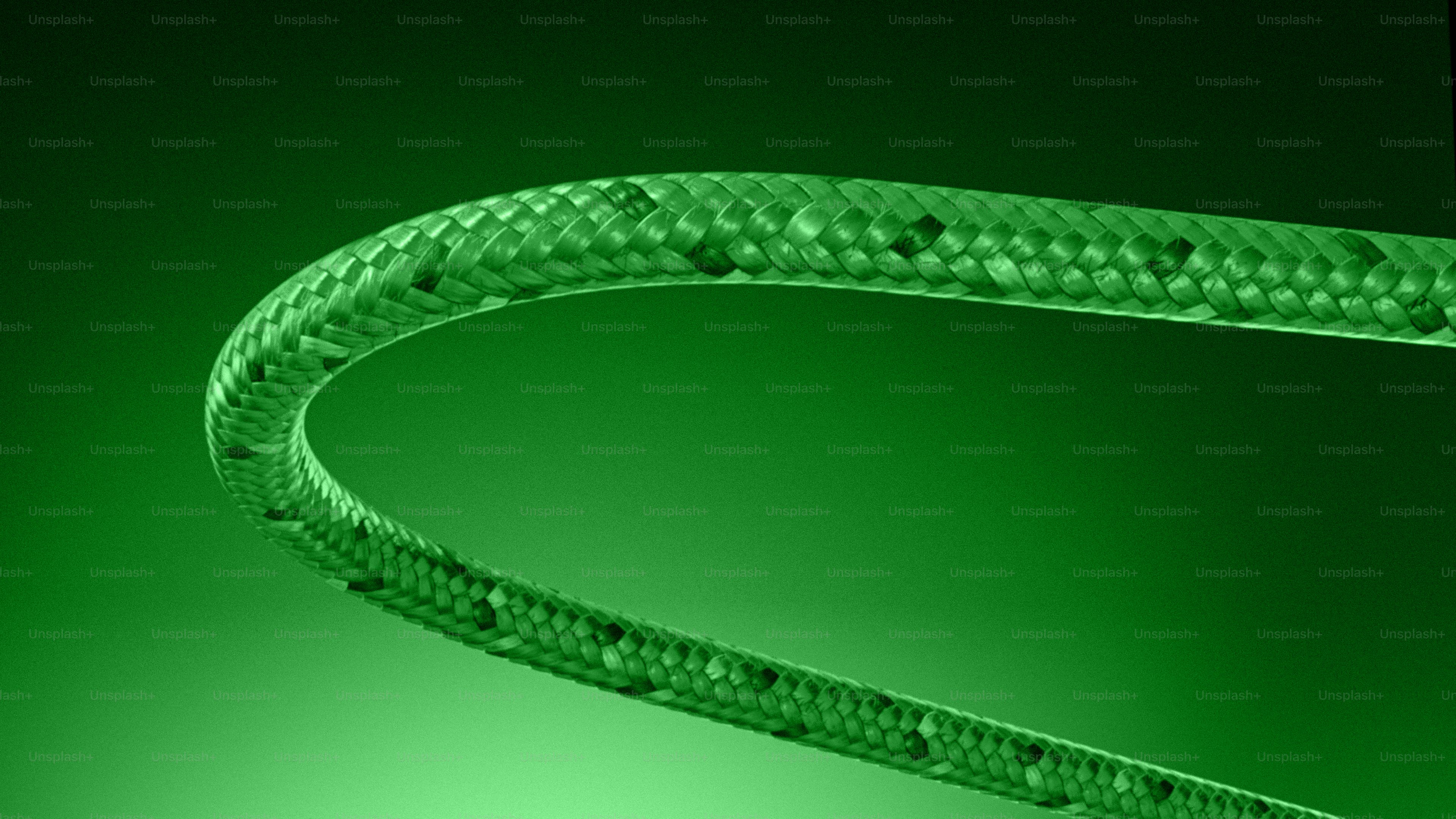 Green textured tube curving against a gradient background