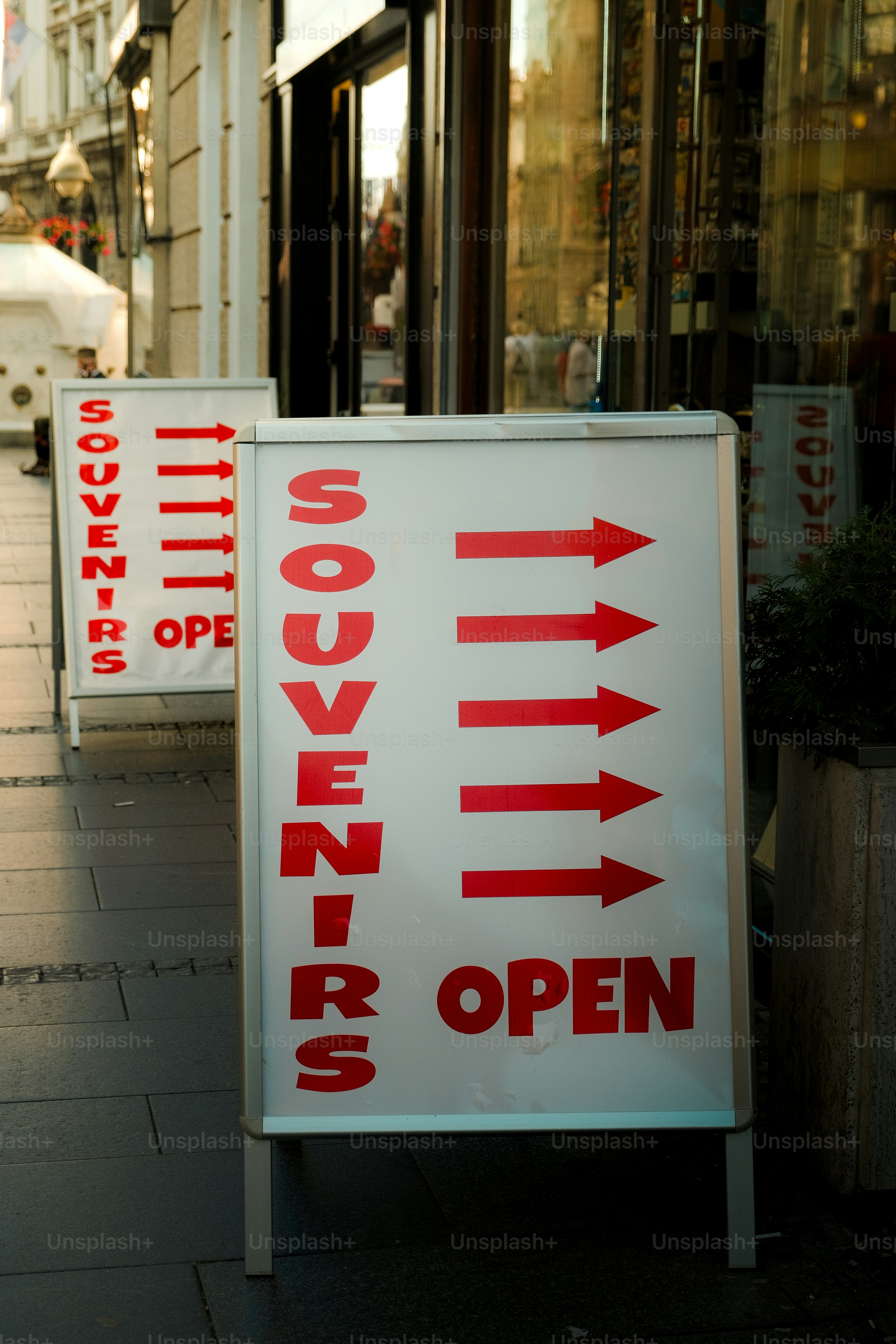 White signs with red text point the way.