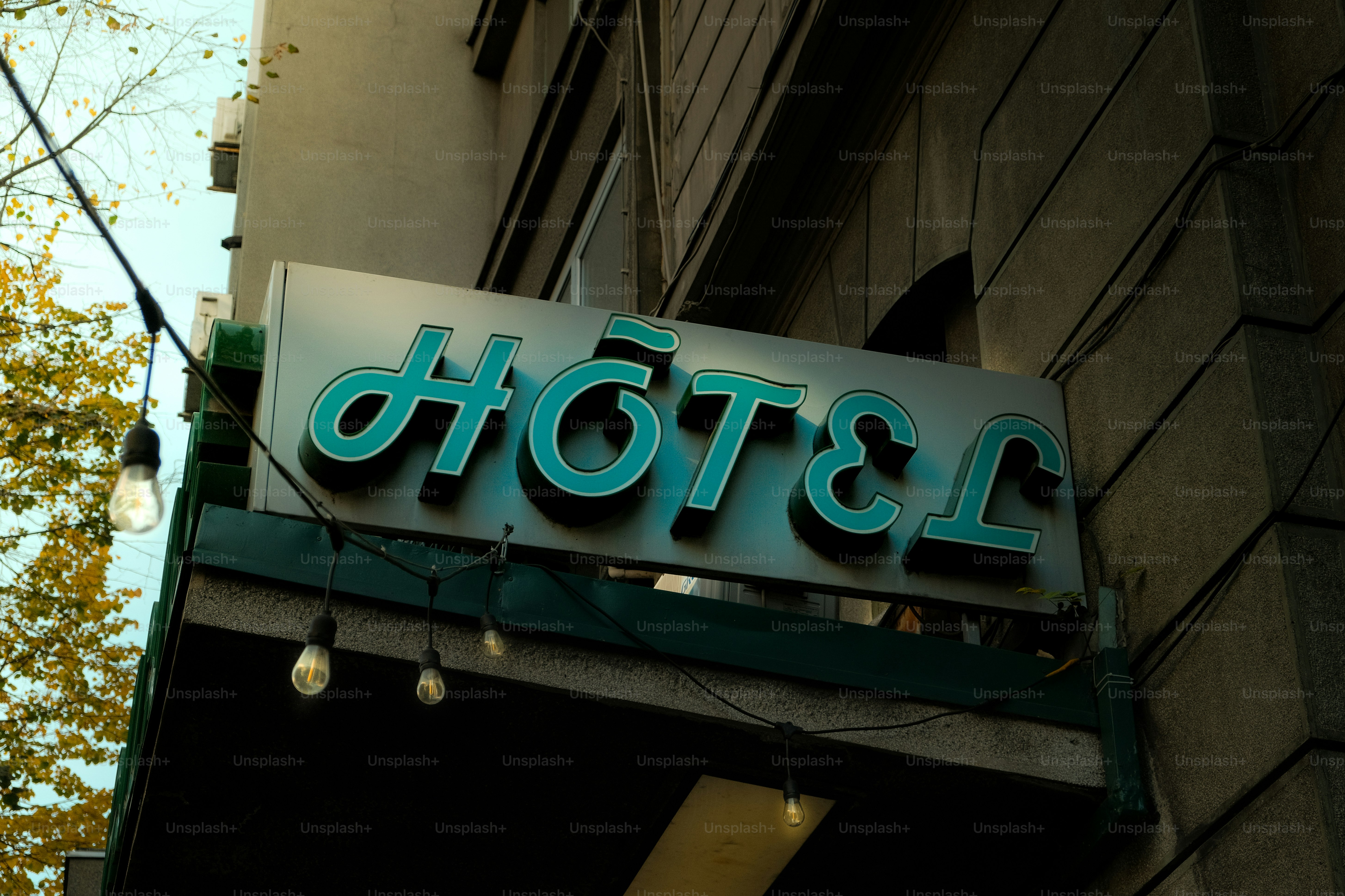 Hotel sign with decorative lights at night