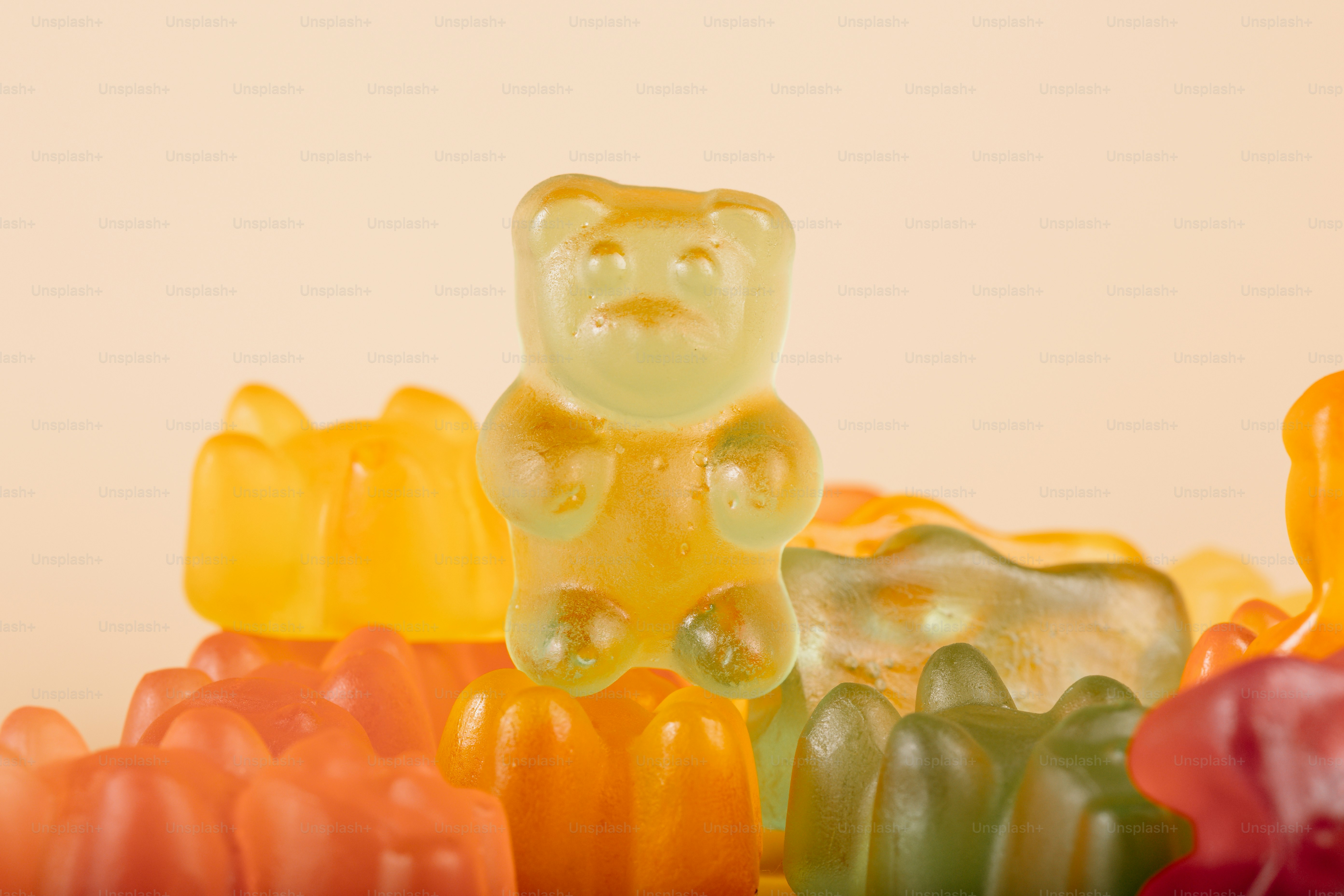 A group of colorful gummy bears on a light background