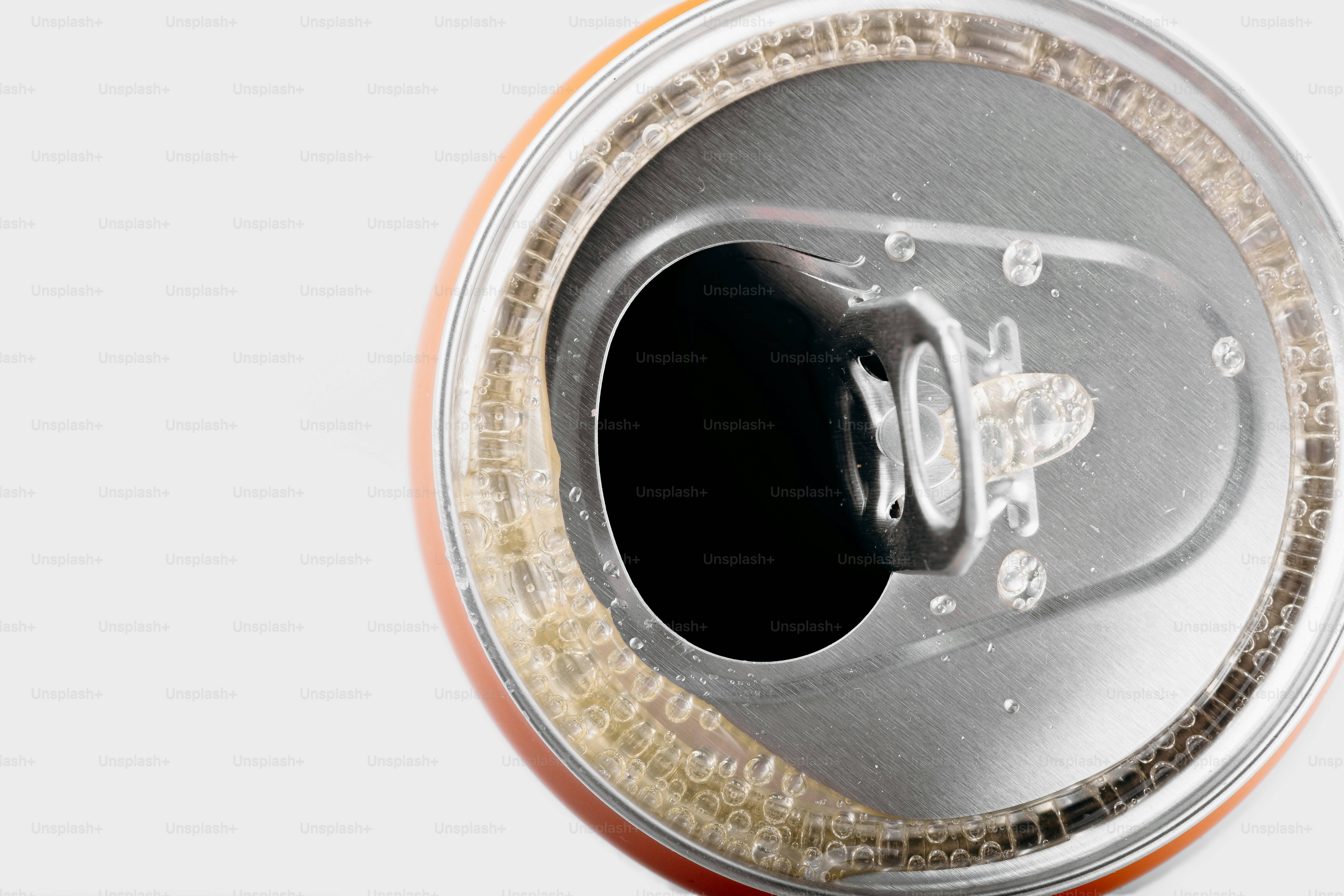 Close-up of an opened soda can with condensation