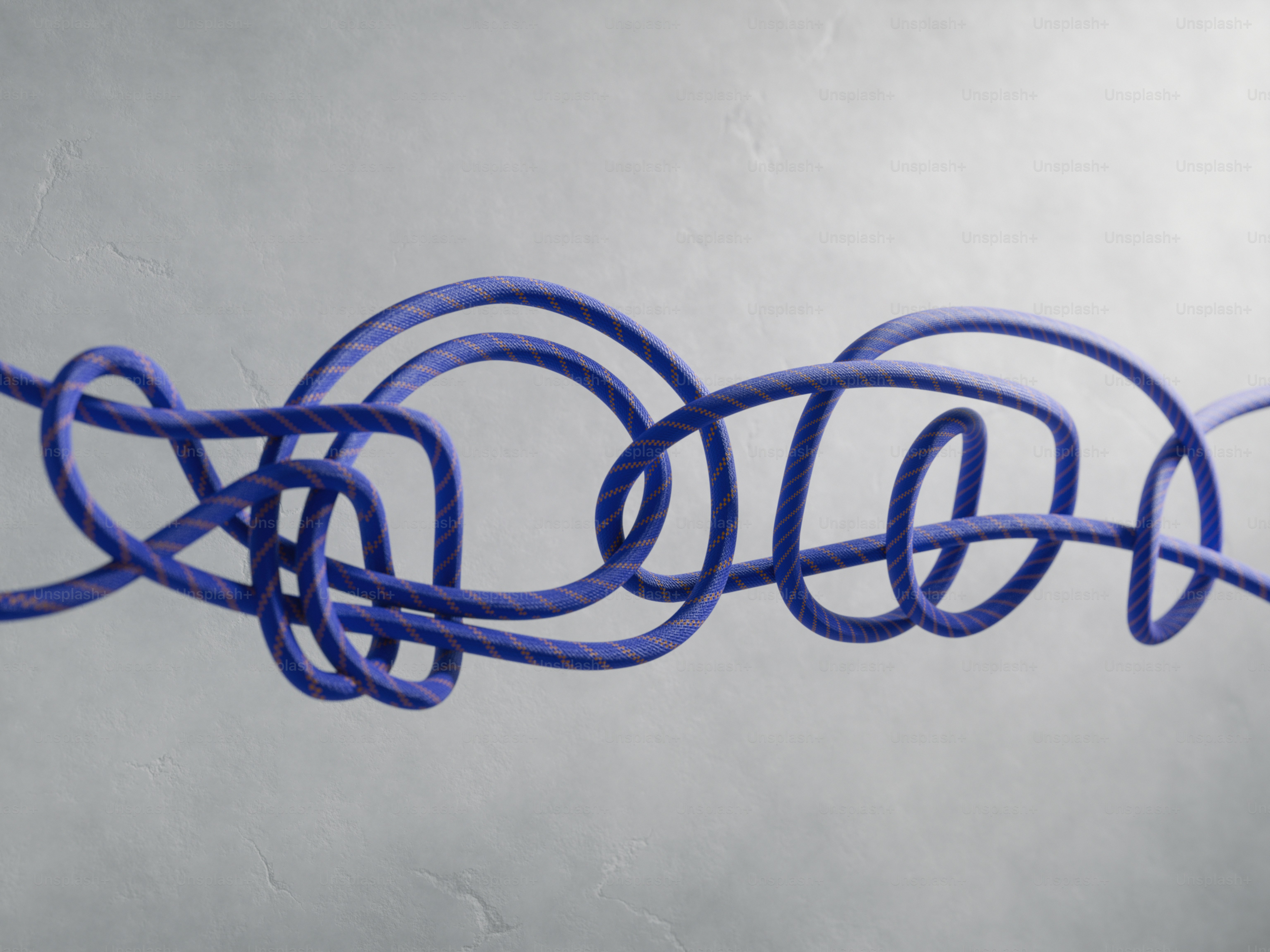 A complex knot tied with orange rope photo – 3d render Image on Unsplash