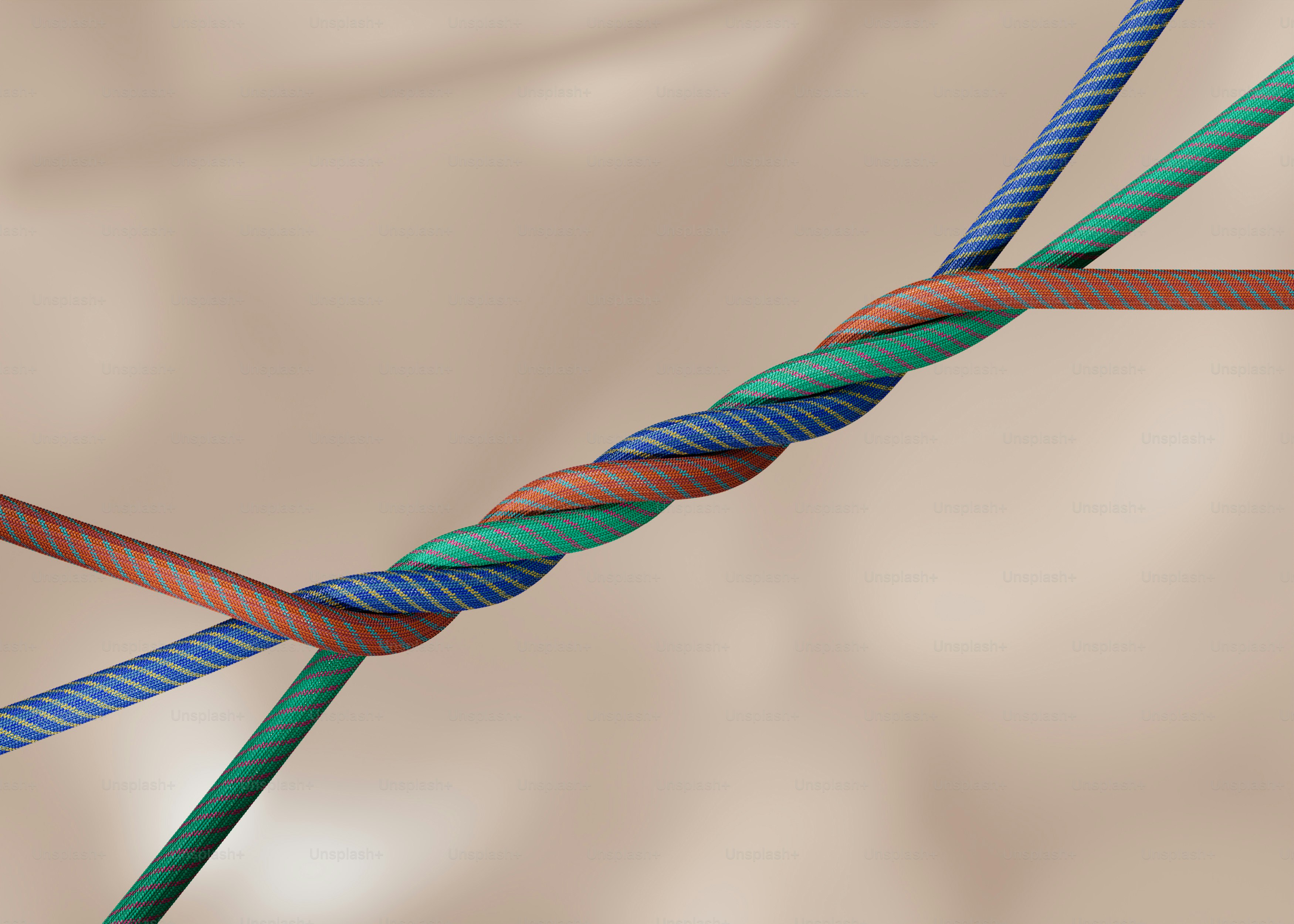 Three colorful ropes twisted together in a knot photo – Texture Image ...