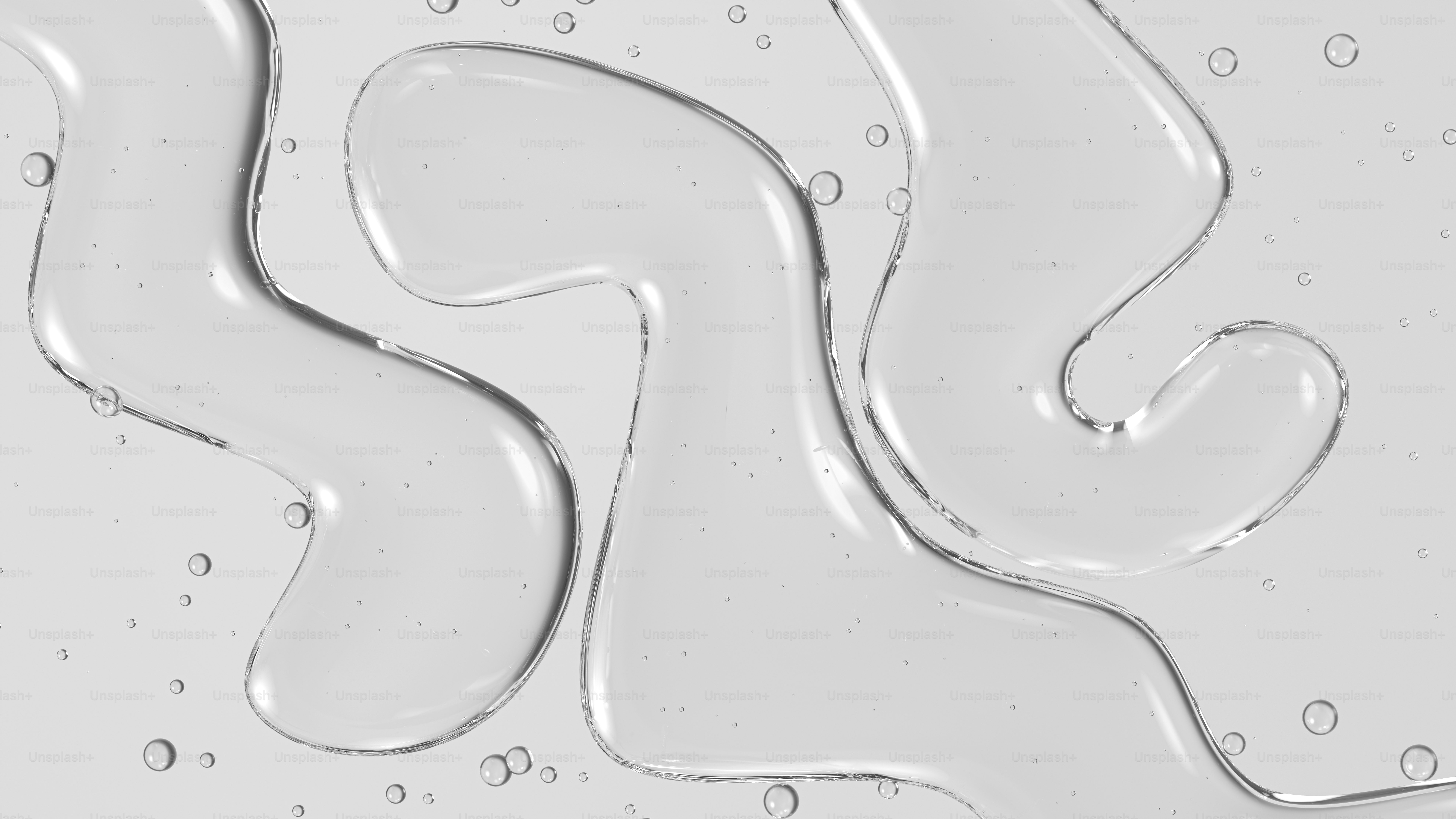 Clear liquid forming abstract shapes with small bubbles