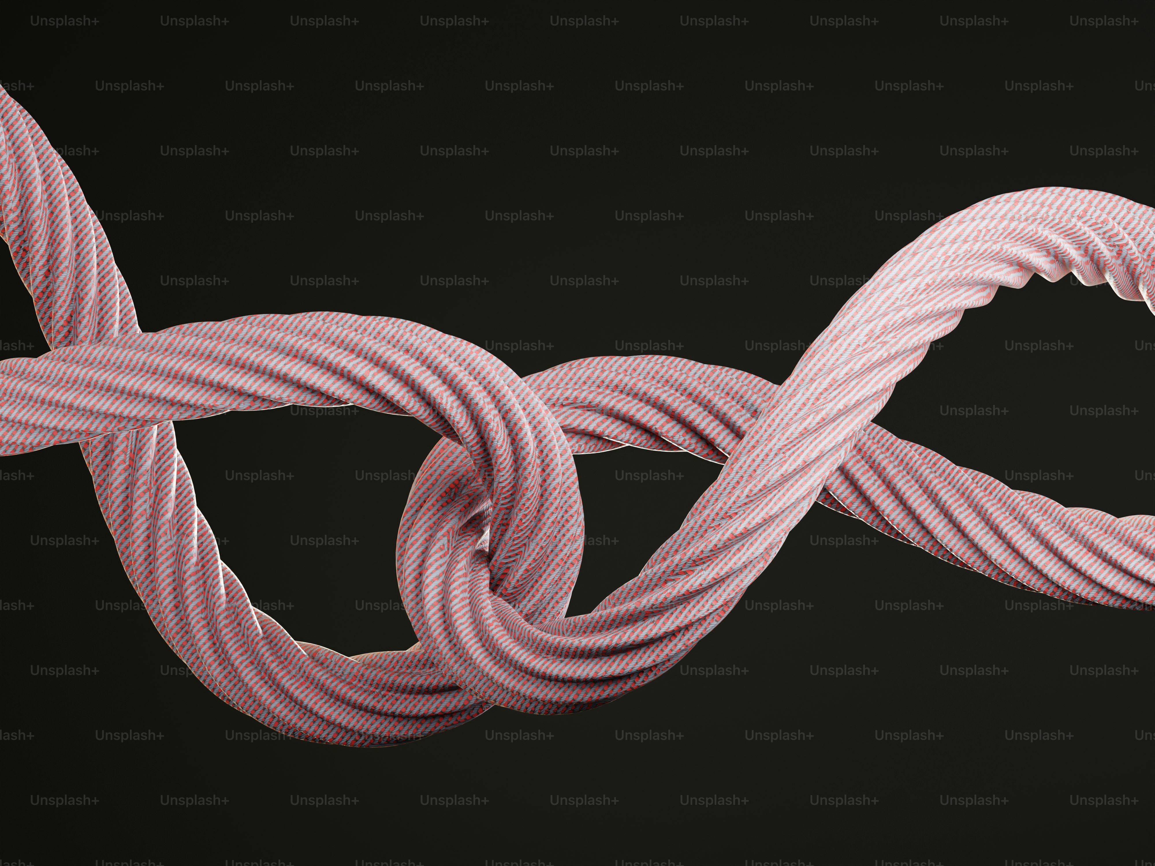 Two pink twisted ropes knotted together