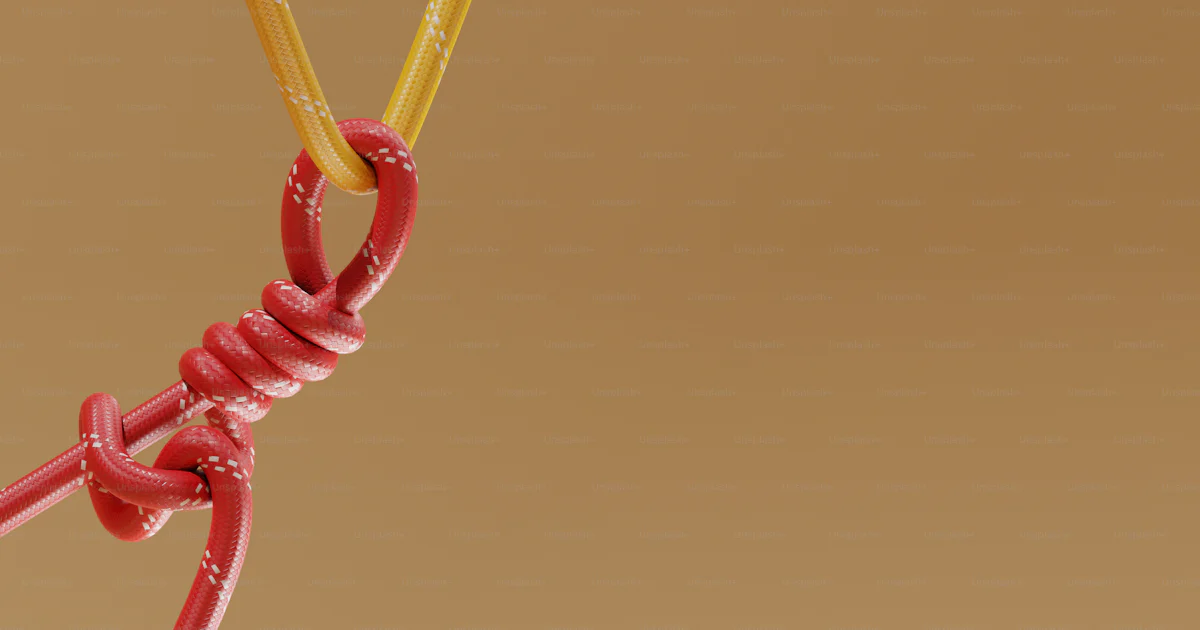 Red and yellow ropes tied together with a knot photo – Abstract Image ...