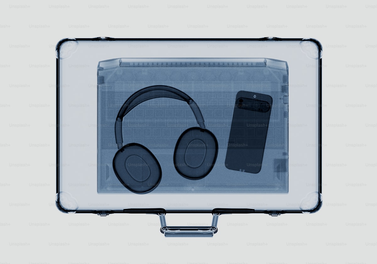 X-ray of headphones and smartphone in a briefcase.