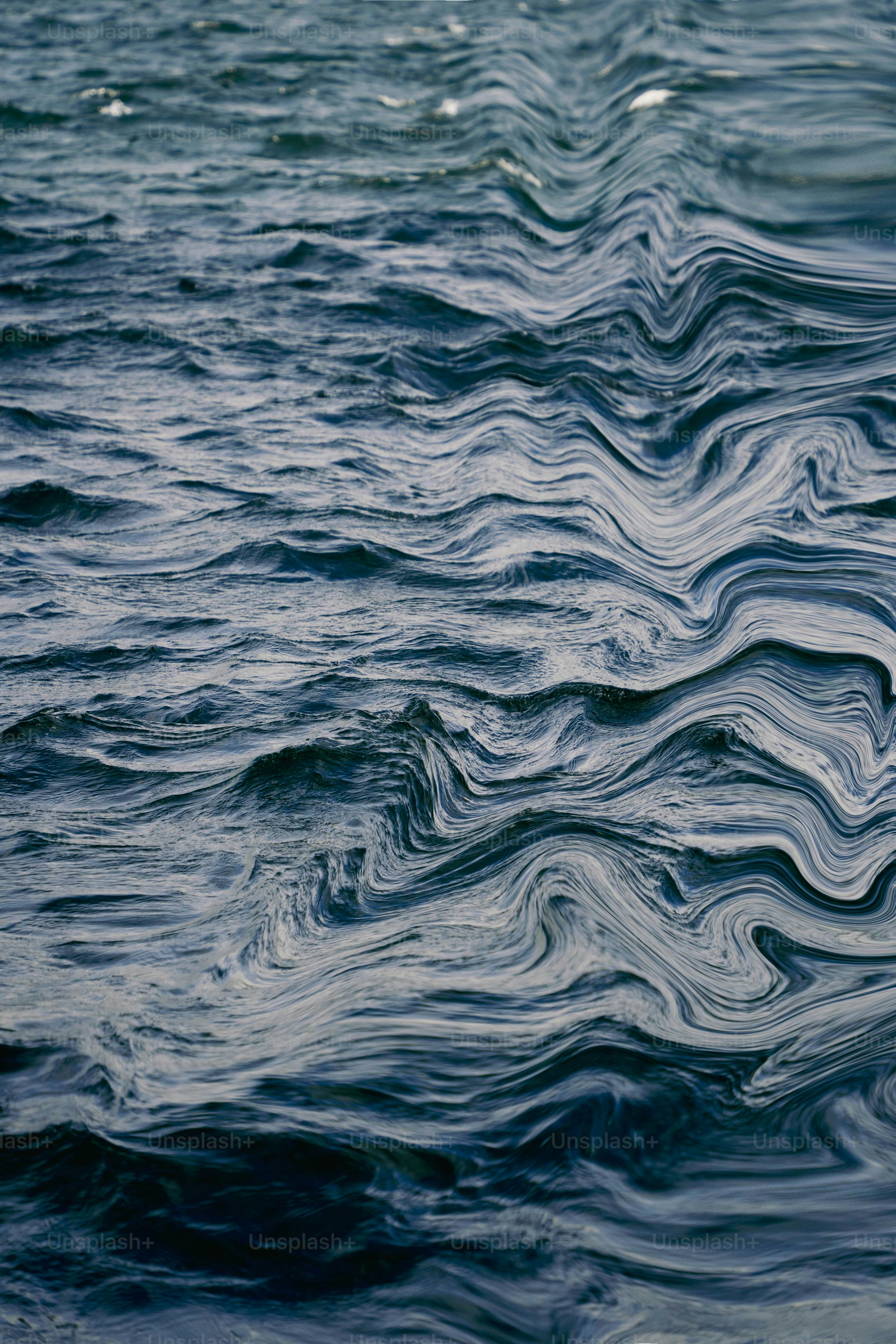 Abstract pattern of dark blue ocean waves.