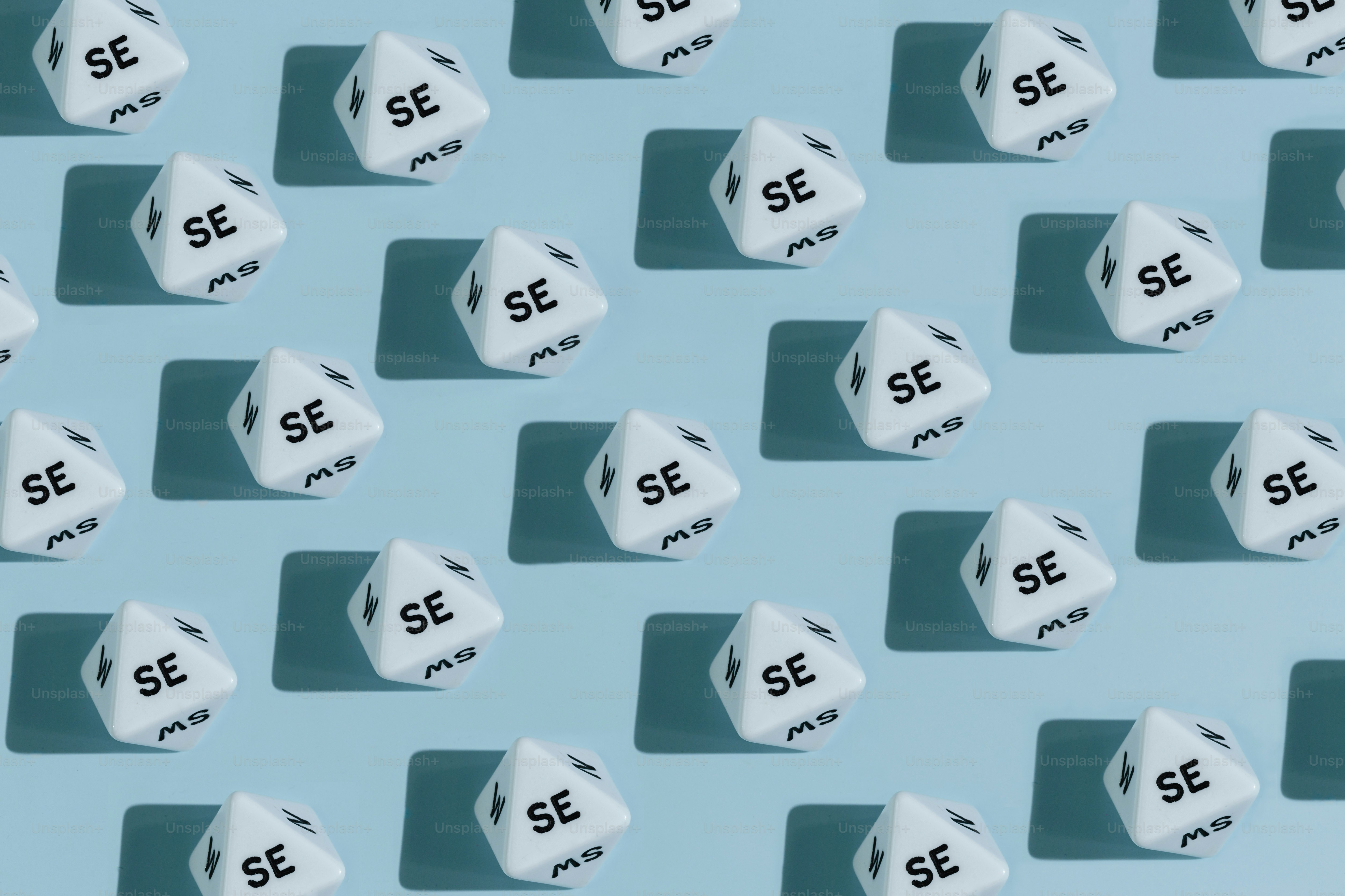 White dice with se text on blue background