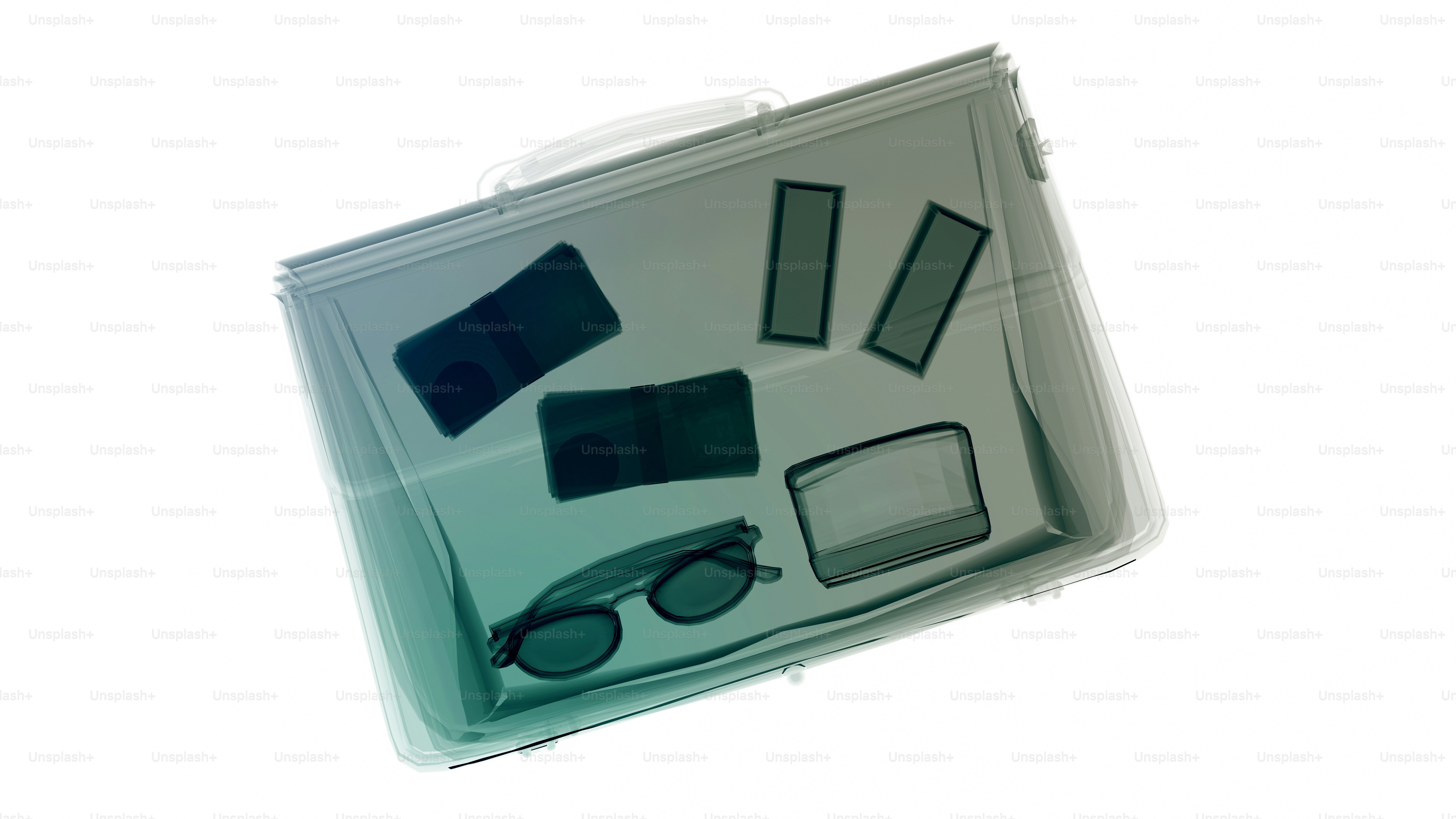 X-ray of a clear bag with sunglasses and cards