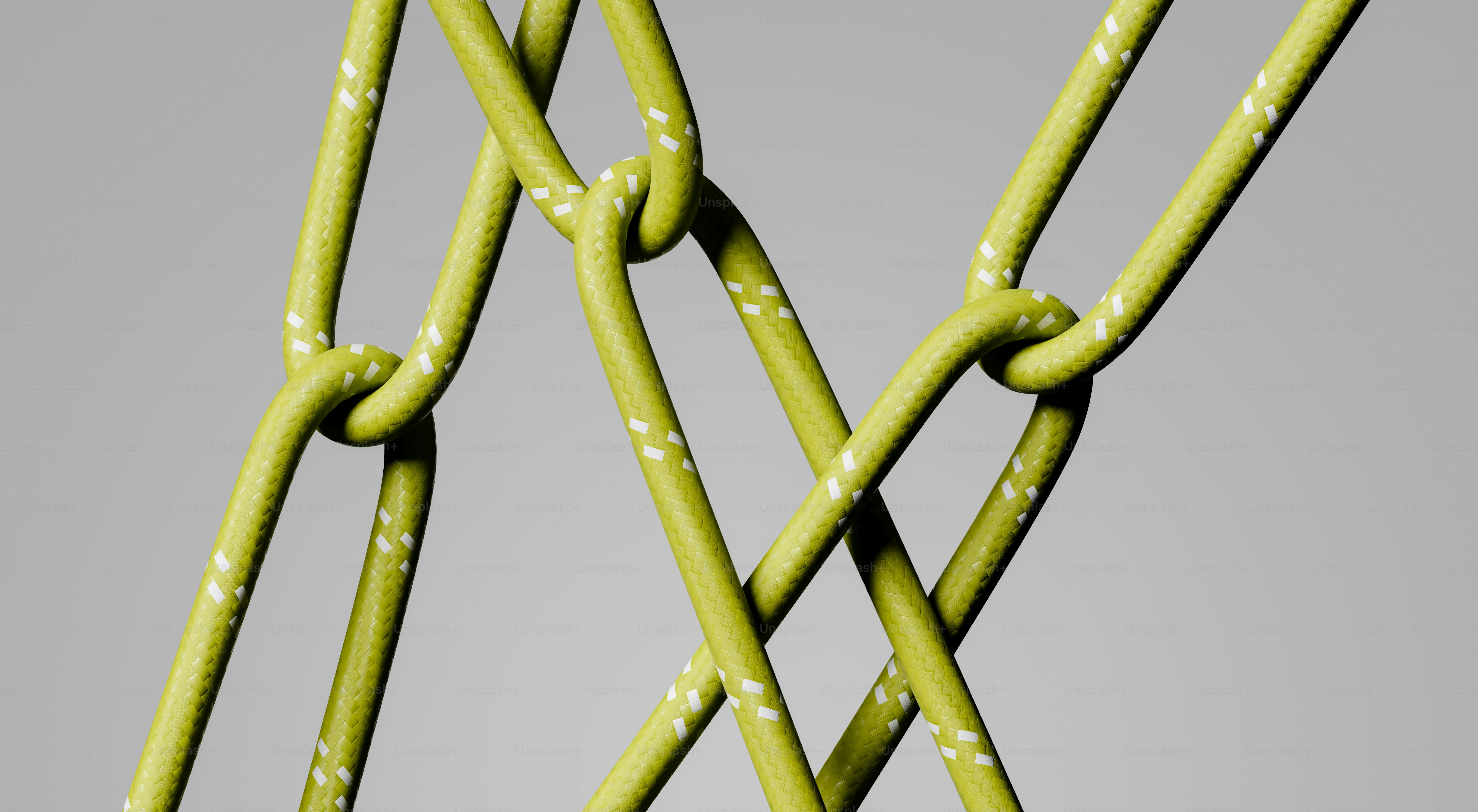 Close-up of a woven green rope with white flecks.
