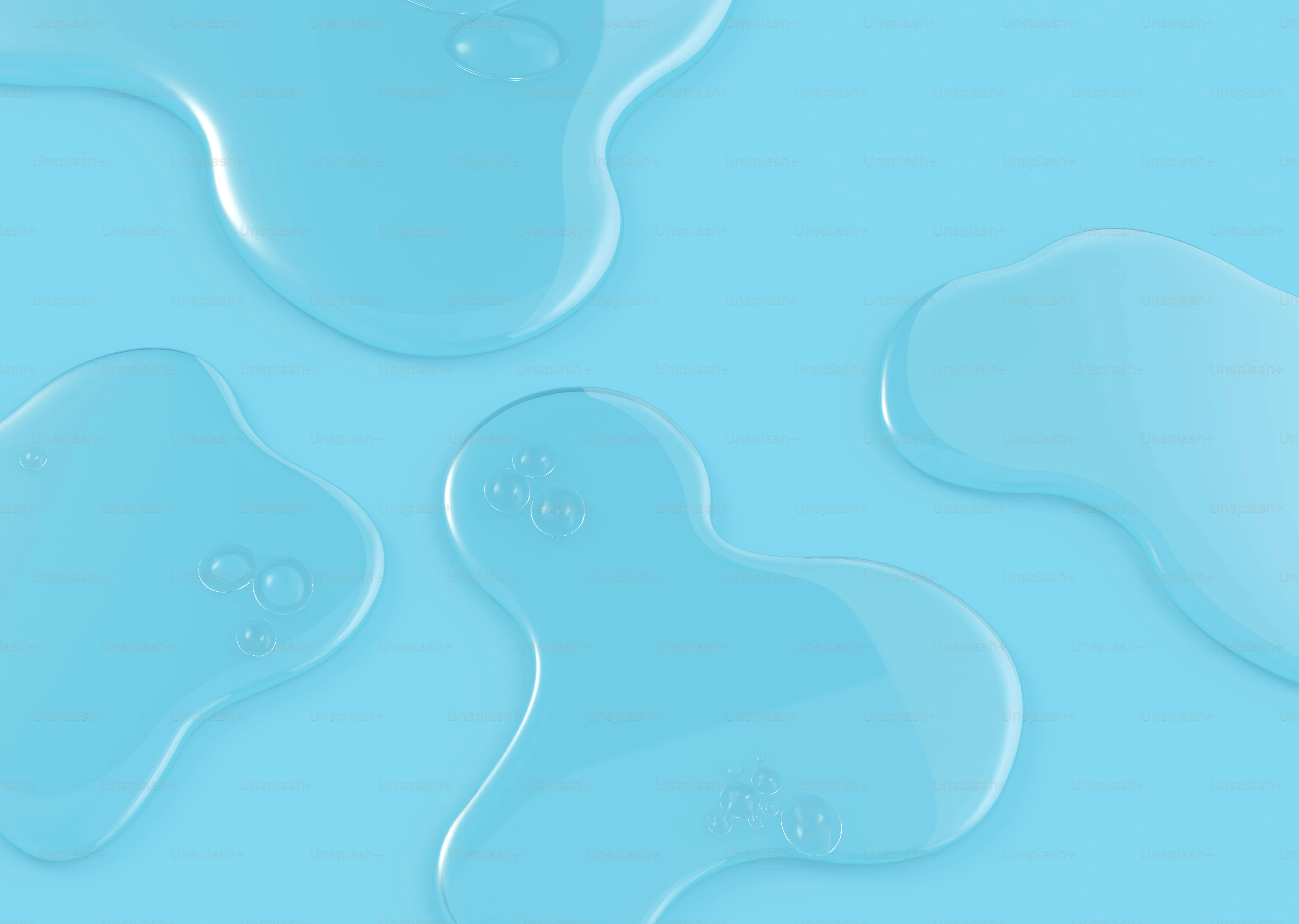 Clear liquid blobs on a light blue surface