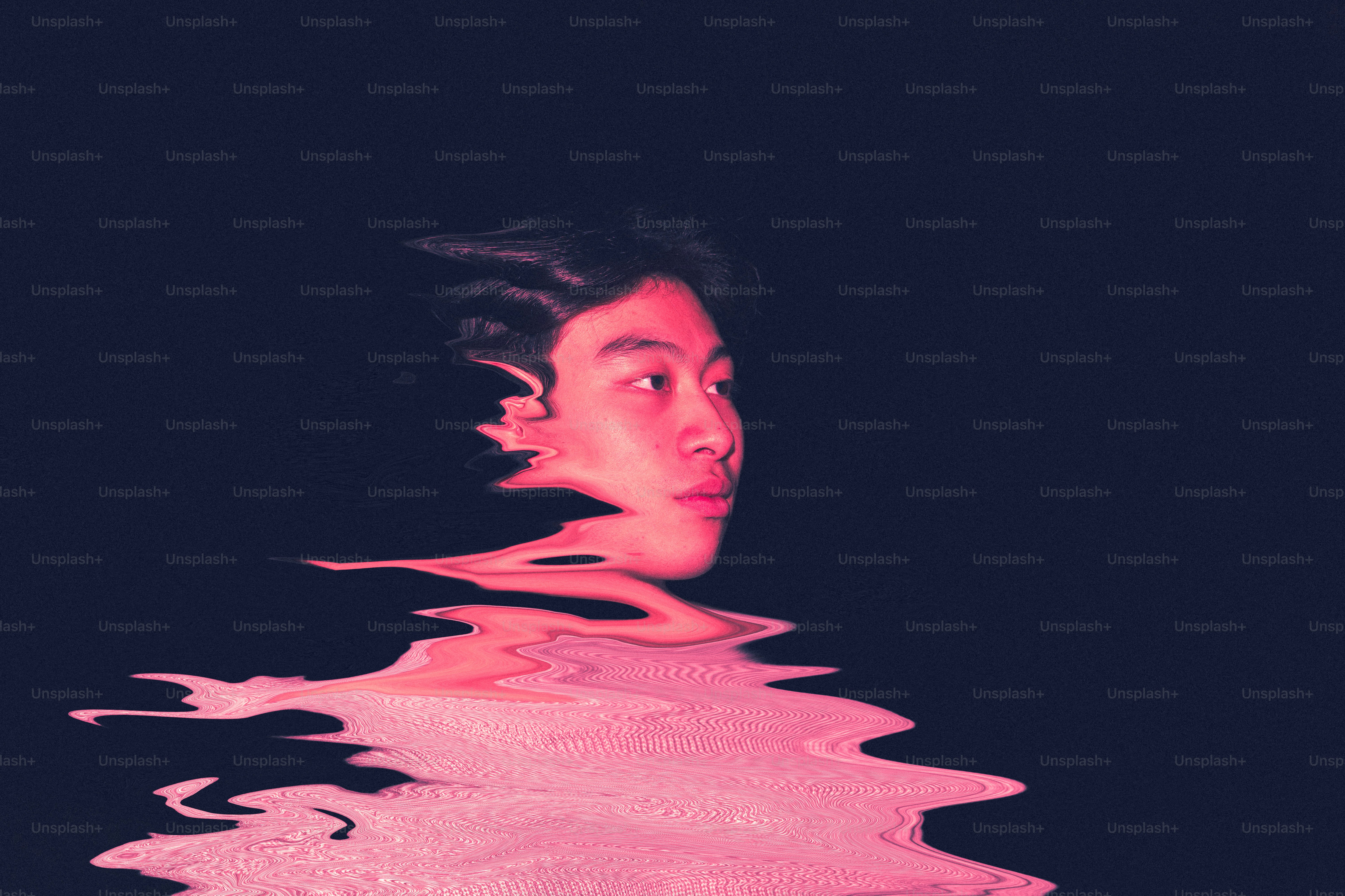 Man's face distorted by pink water effect