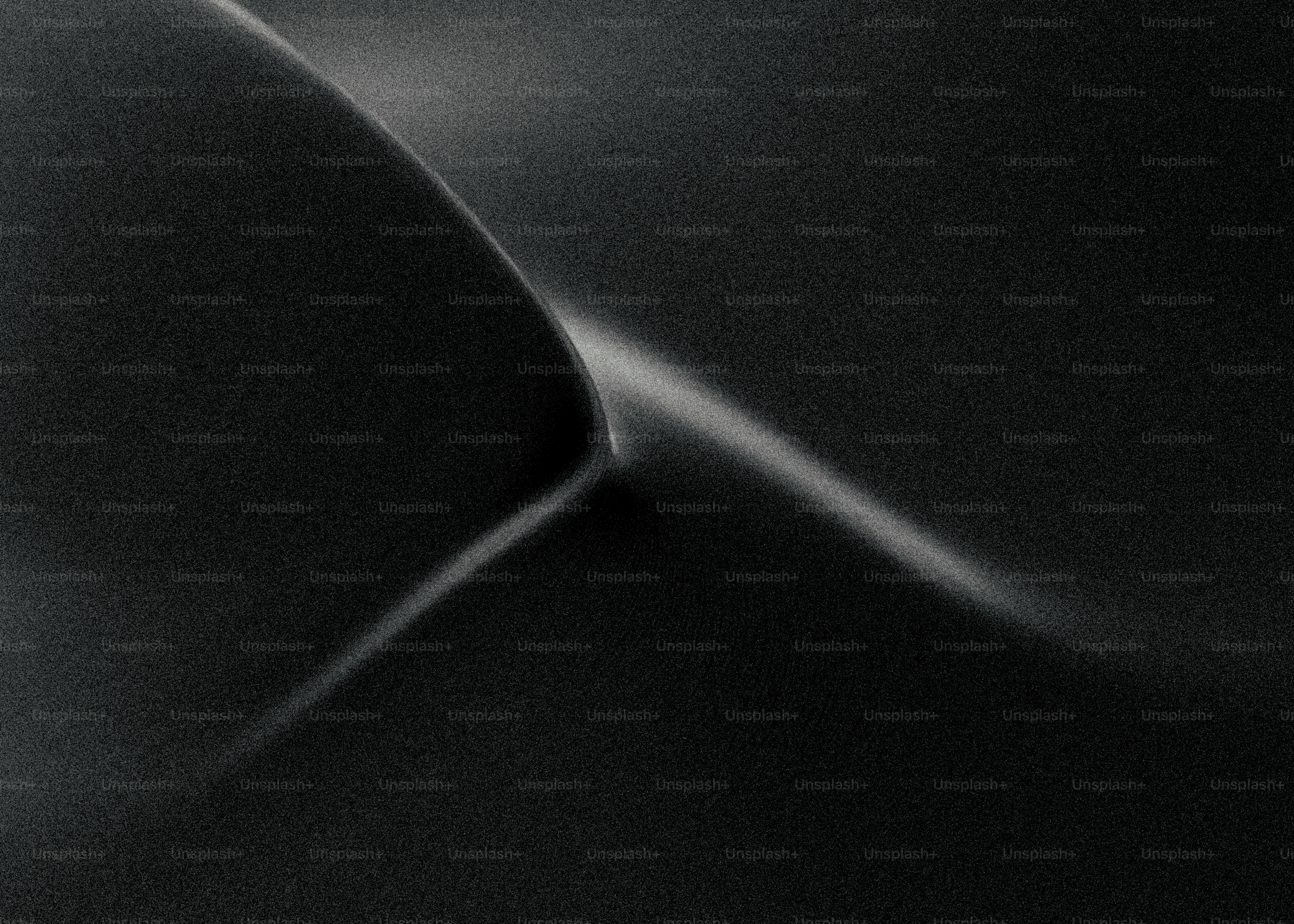 Abstract dark gray flowing lines with light highlights