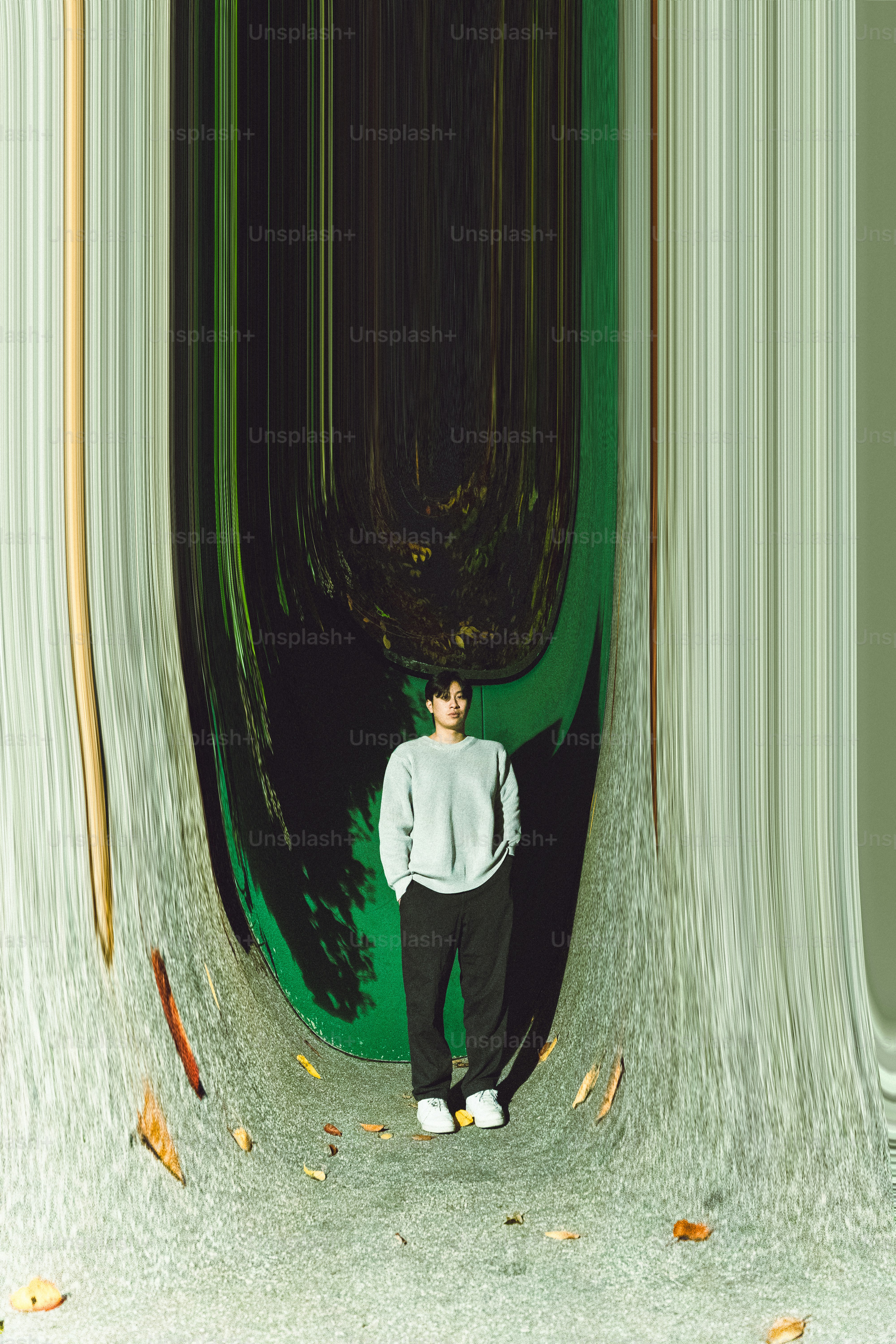 Man standing in a distorted green and grey environment