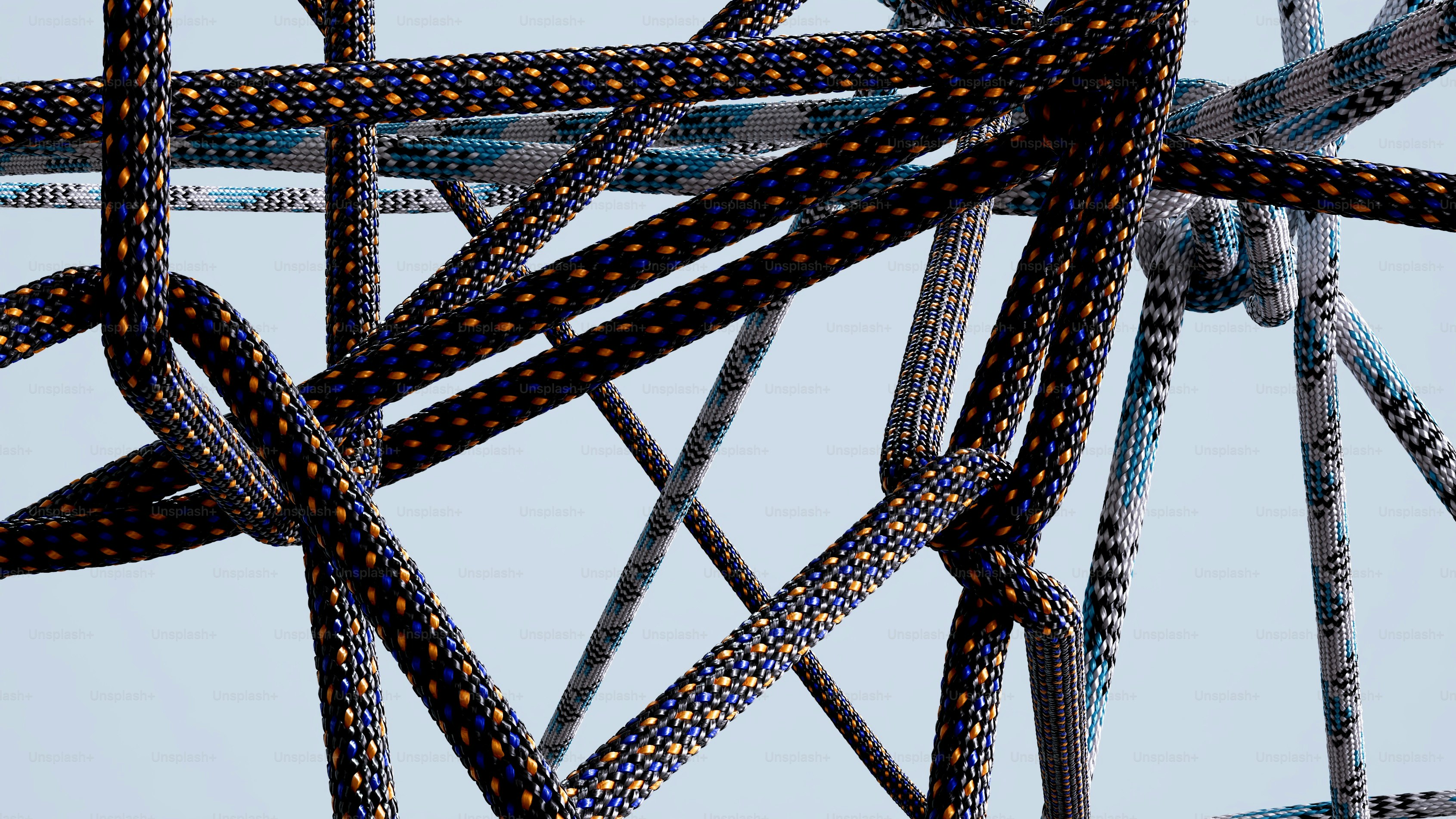 Tangled ropes form a complex abstract pattern.