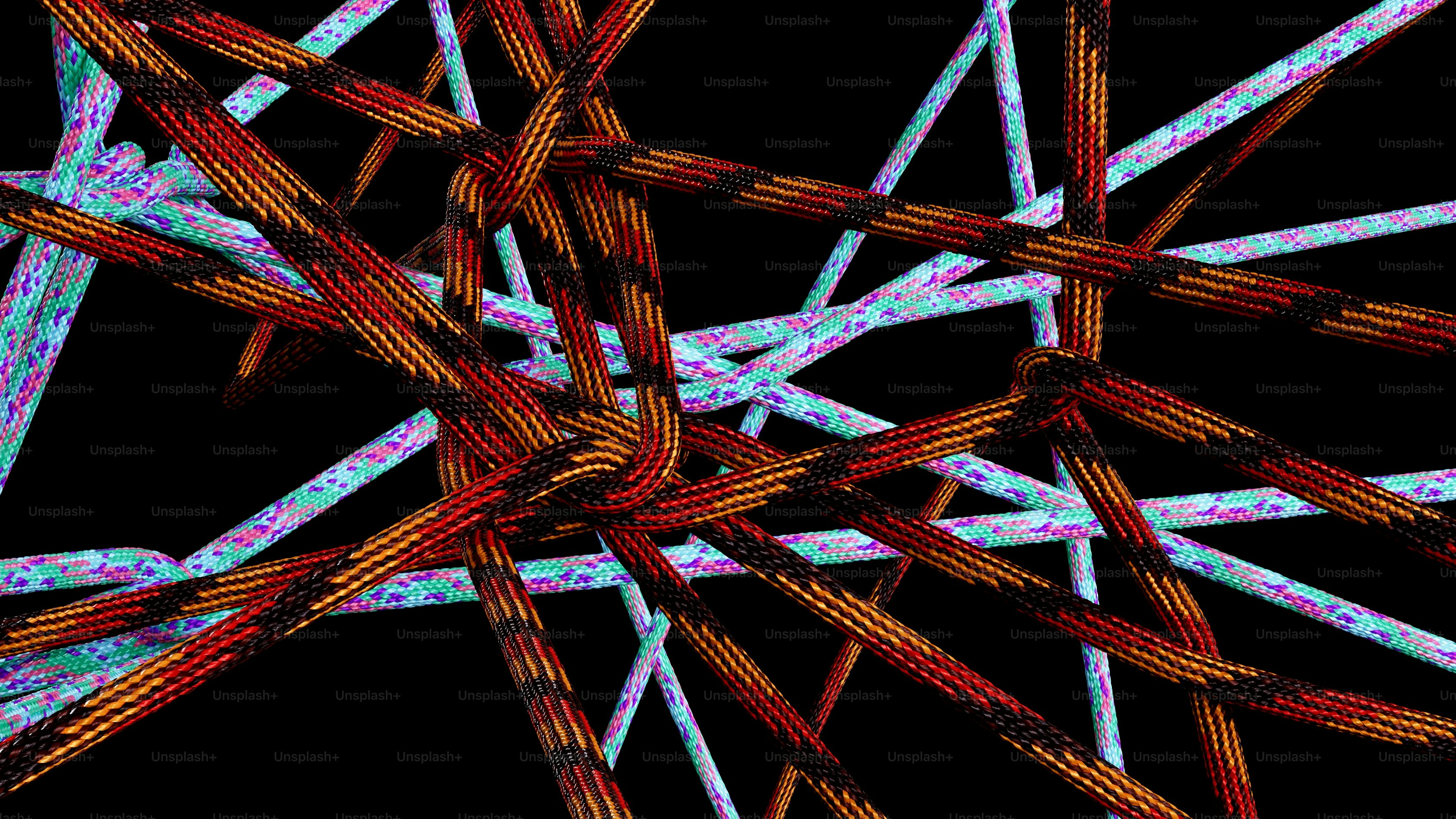 Tangled colorful ropes on a black background