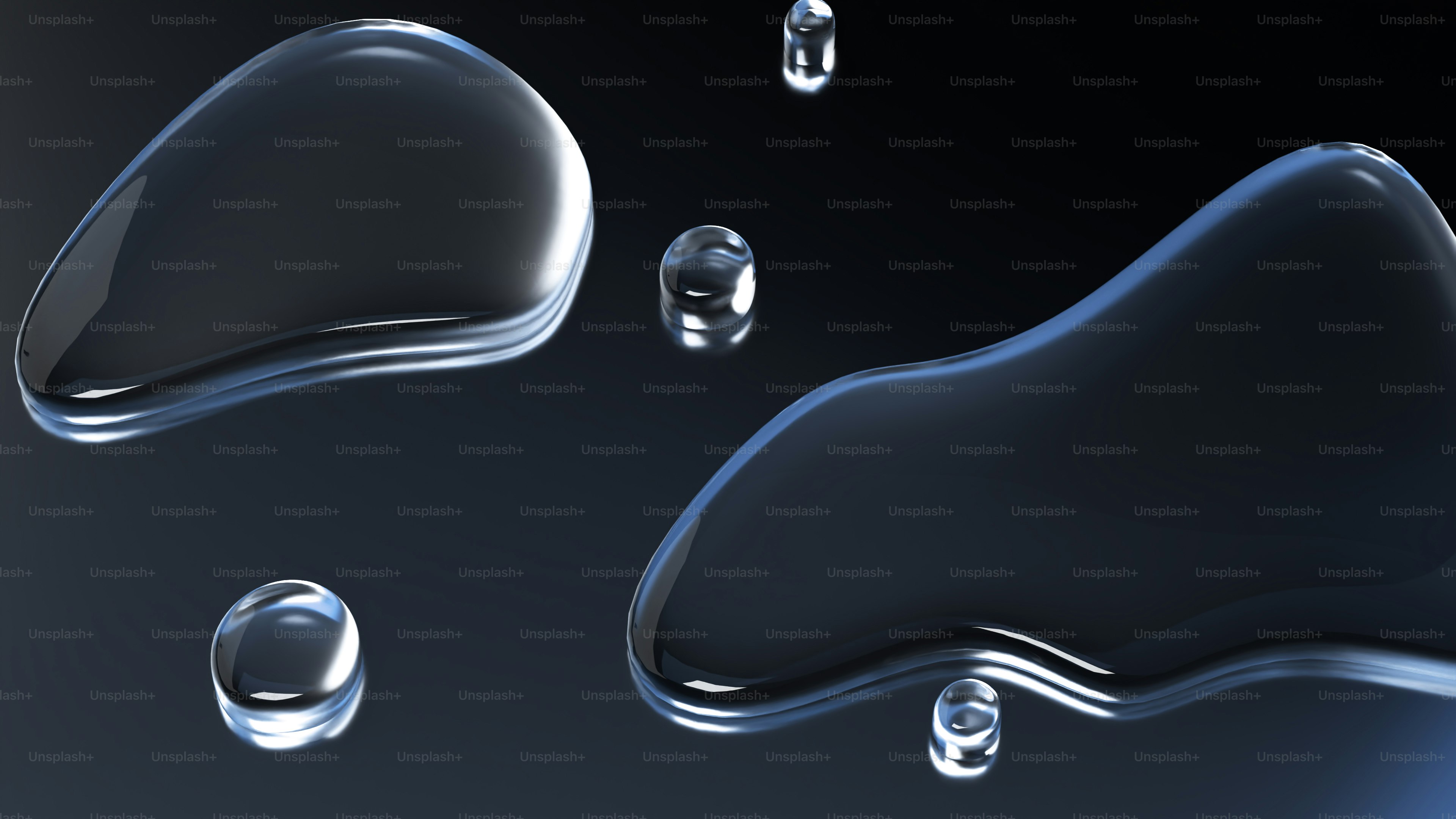 Clear water droplets on a dark background