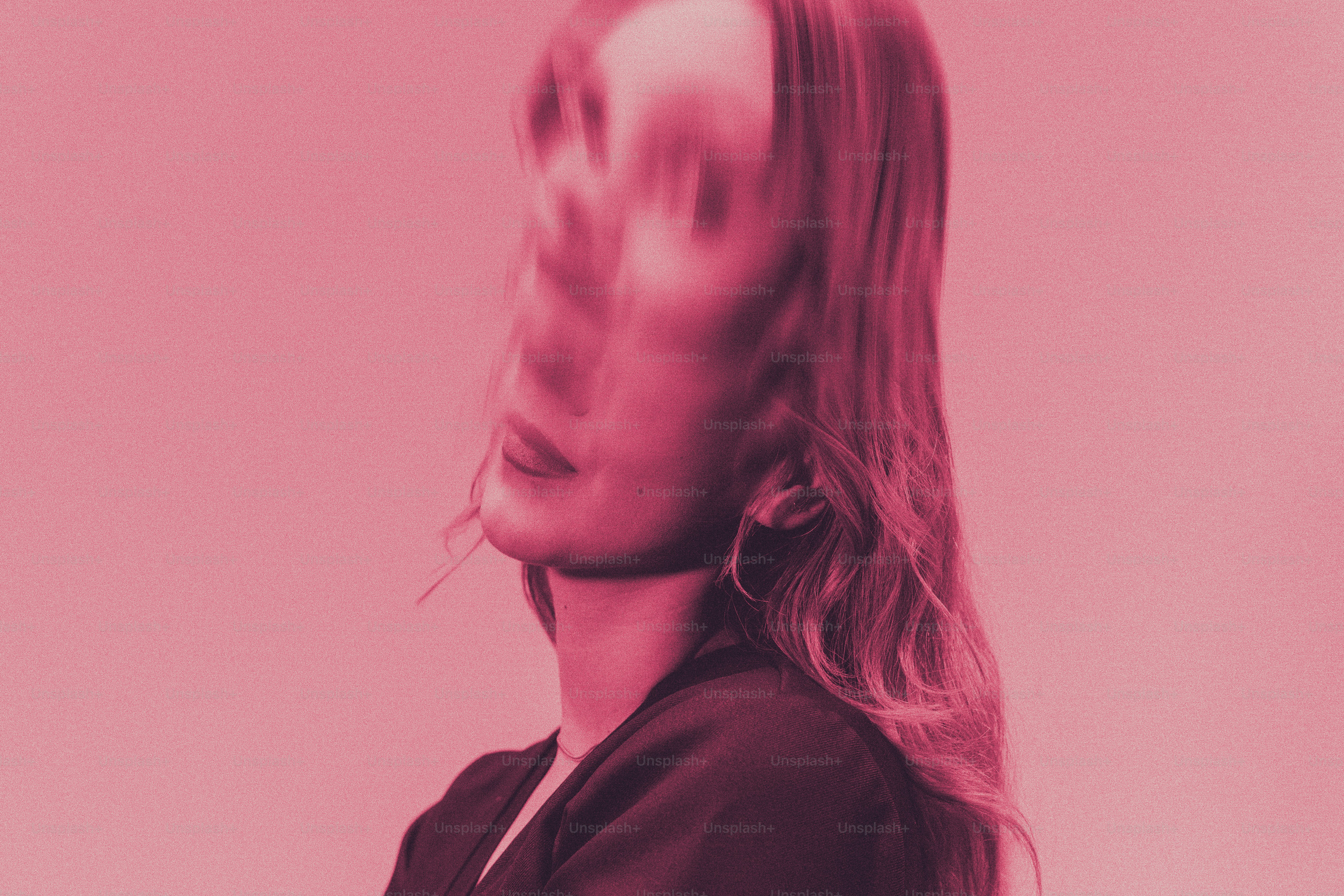 Woman's face blurred with pink overlay